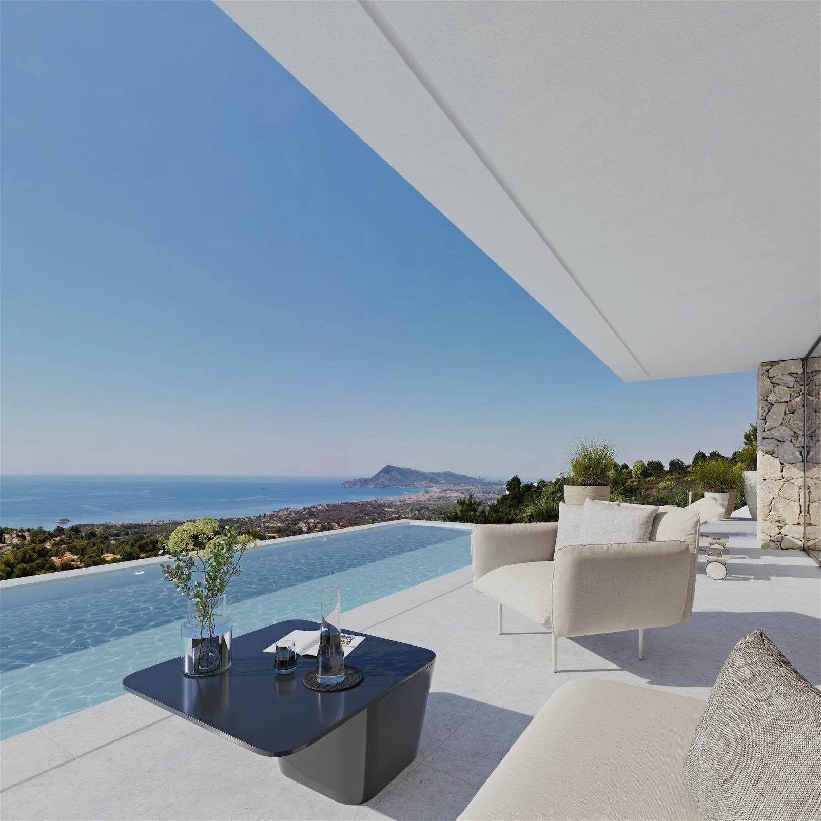 Covered terrace with infinity pool, outdoor seating and panoramic sea views of a 4-bedroom