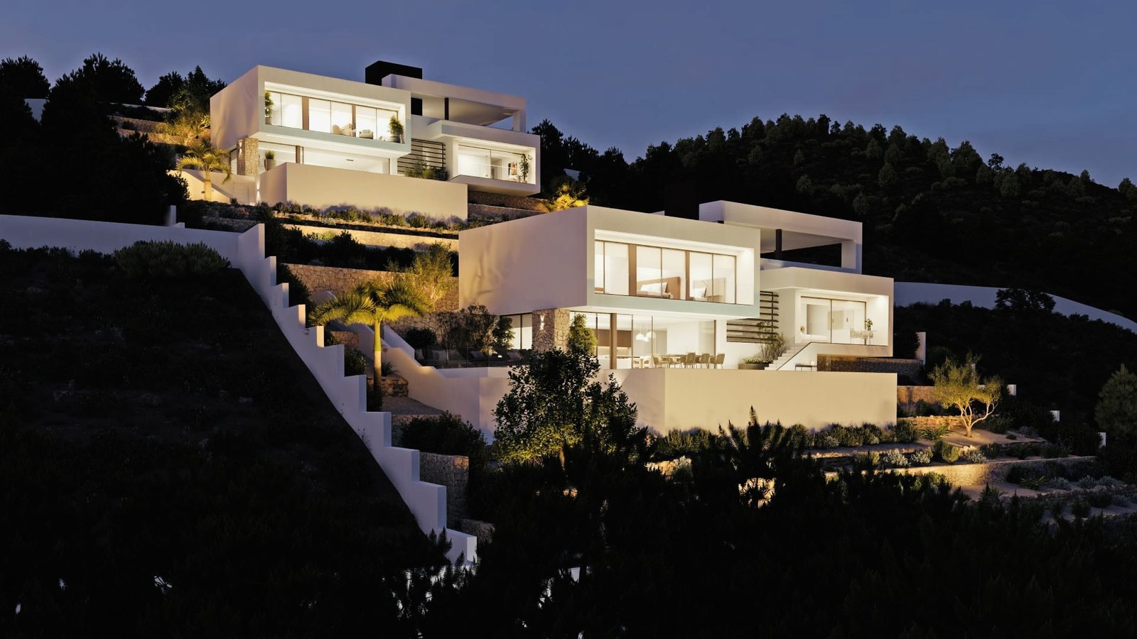 Illuminated modern hillside villa with landscaped terraces at dusk, a 4-bedroom villa