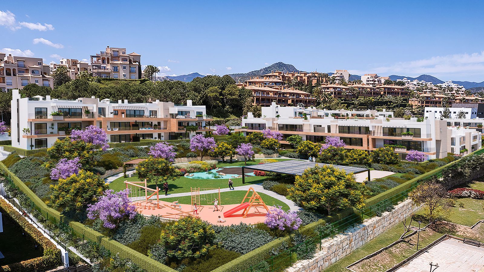 Aerial view of modern apartments, landscaped gardens, pool and playground with mountain views in Estepona - The Estates