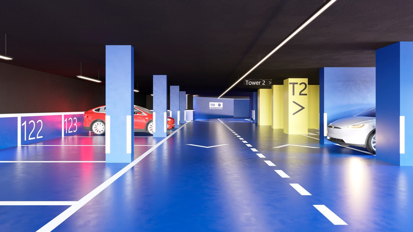 Underground parking garage with marked bays and Tower 2 signage of a 3-bedroom apartment in Benidorm - The Estates