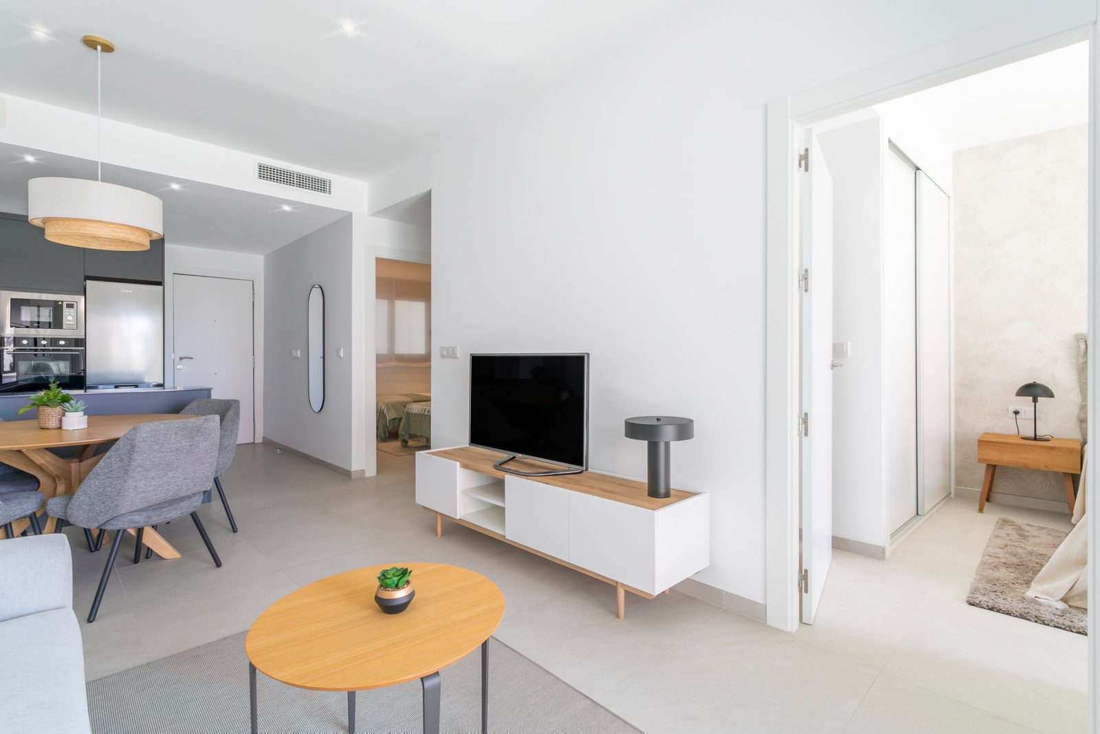 Modern living room and dining area of a 2-bedroom apartment in Torrevieja - The Estates