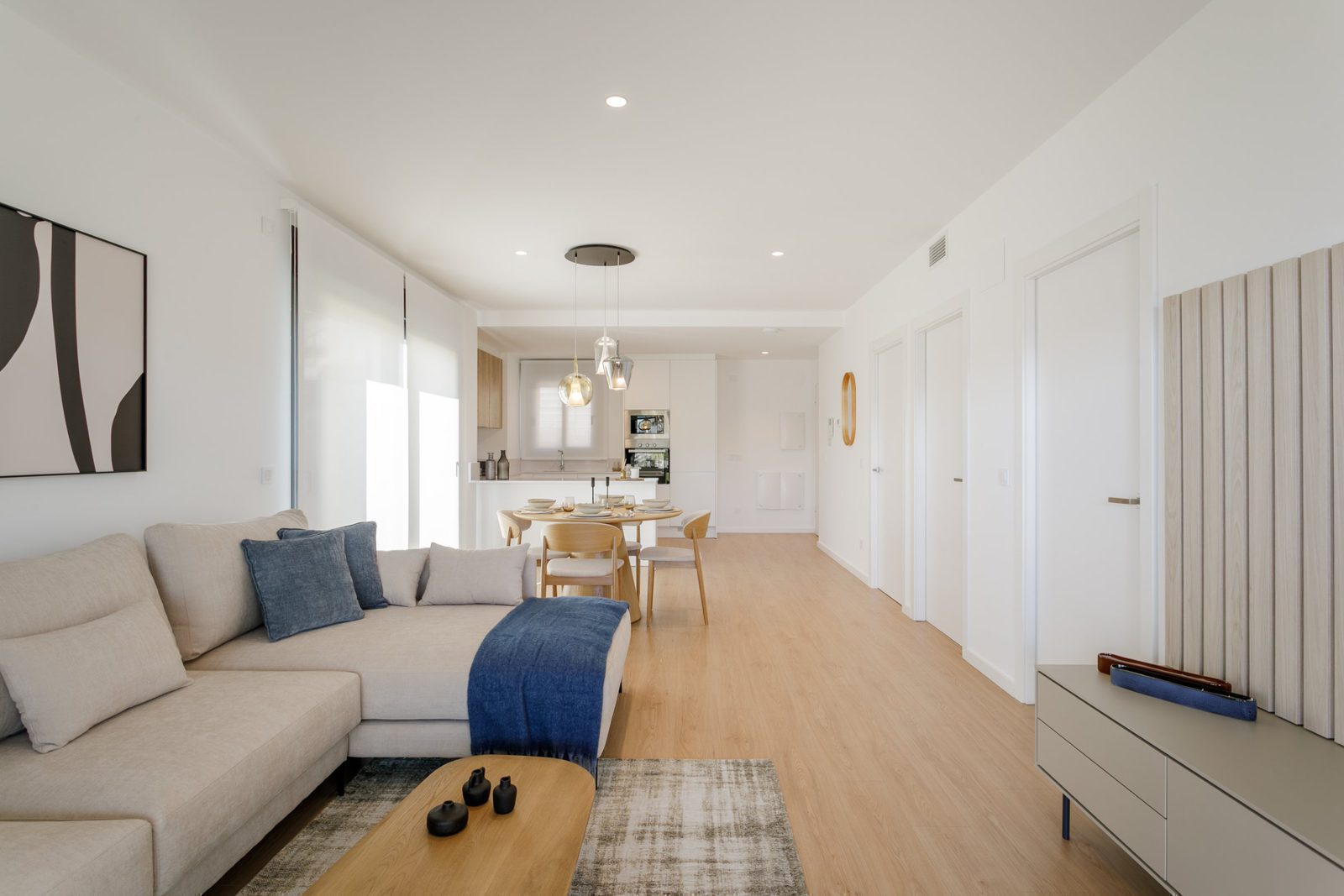 Bright living area with modern kitchen and dining space in a 2-bedroom apartment in Torrevieja - The Estates