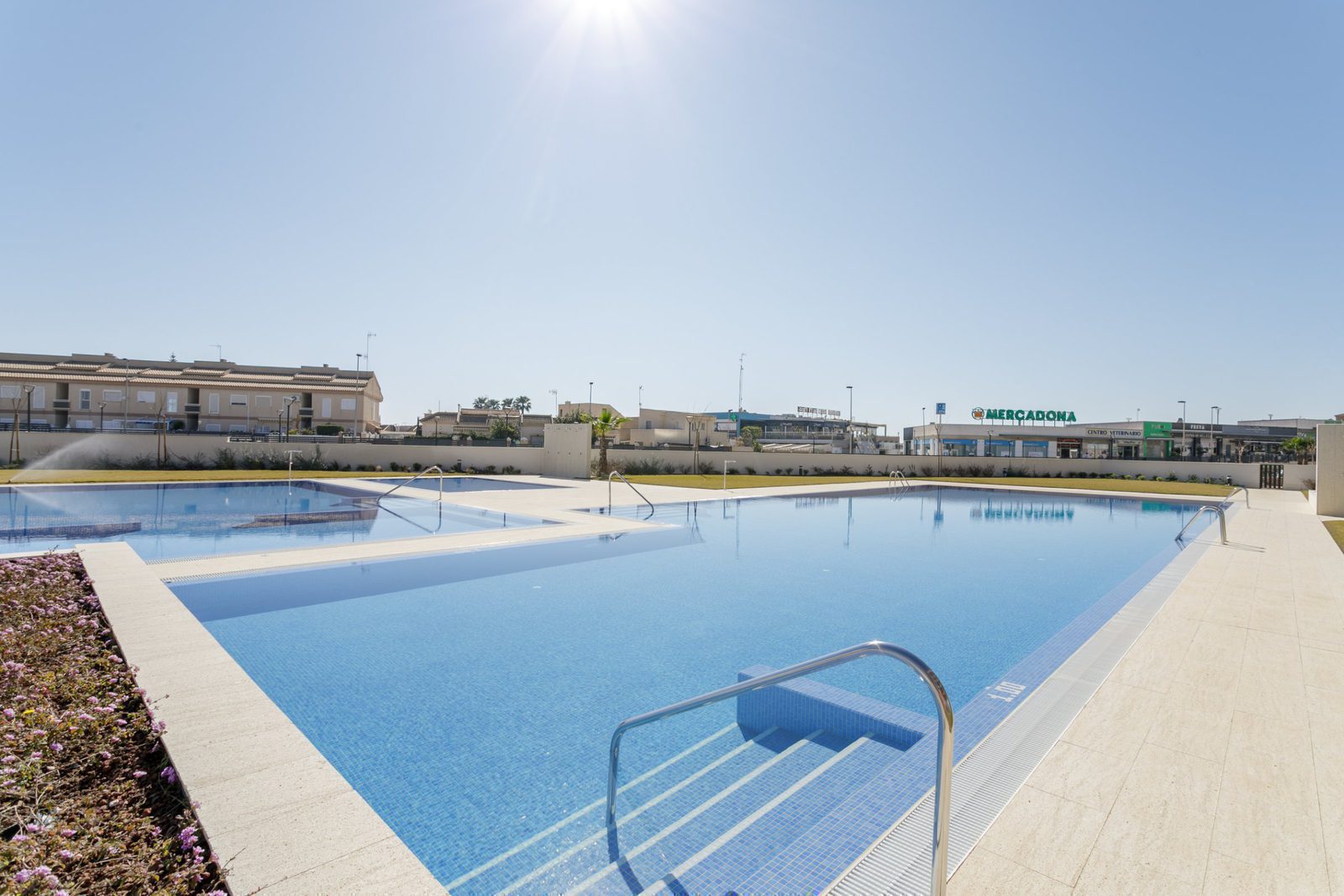 A swimming pool view of a 2-bedroom apartment in Torrevieja - The Estates