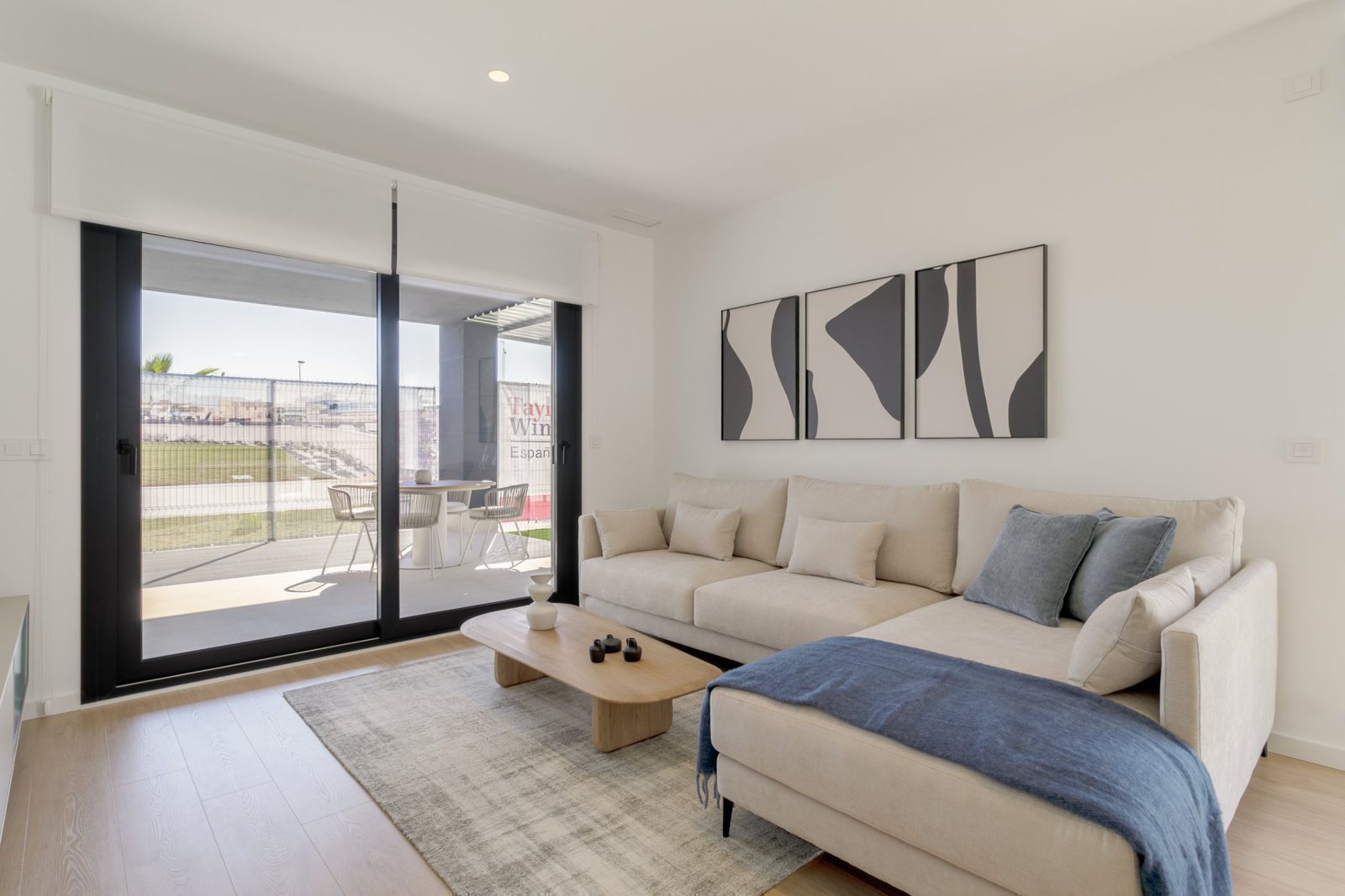 Bright living room with balcony access in a 2-bedroom apartment in Torrevieja - The Estates