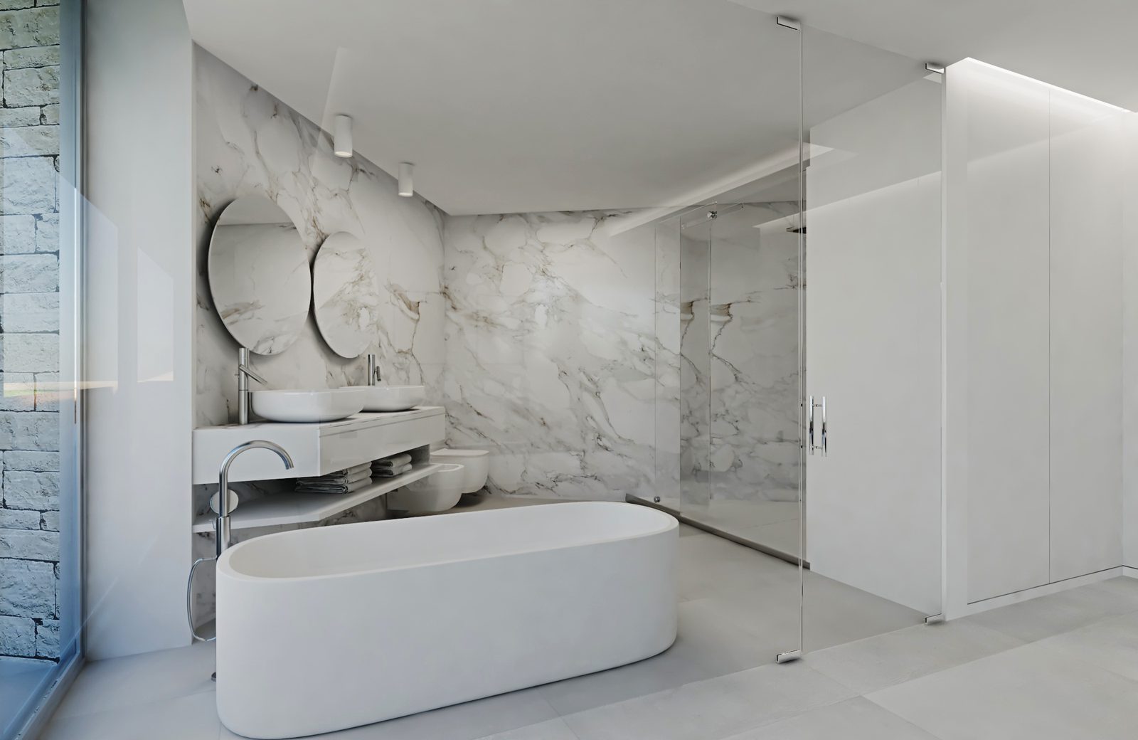 Marble bathroom with a freestanding bathtub, twin basins and glass shower in a 3-bedroom apartment in Calpe - The Estates