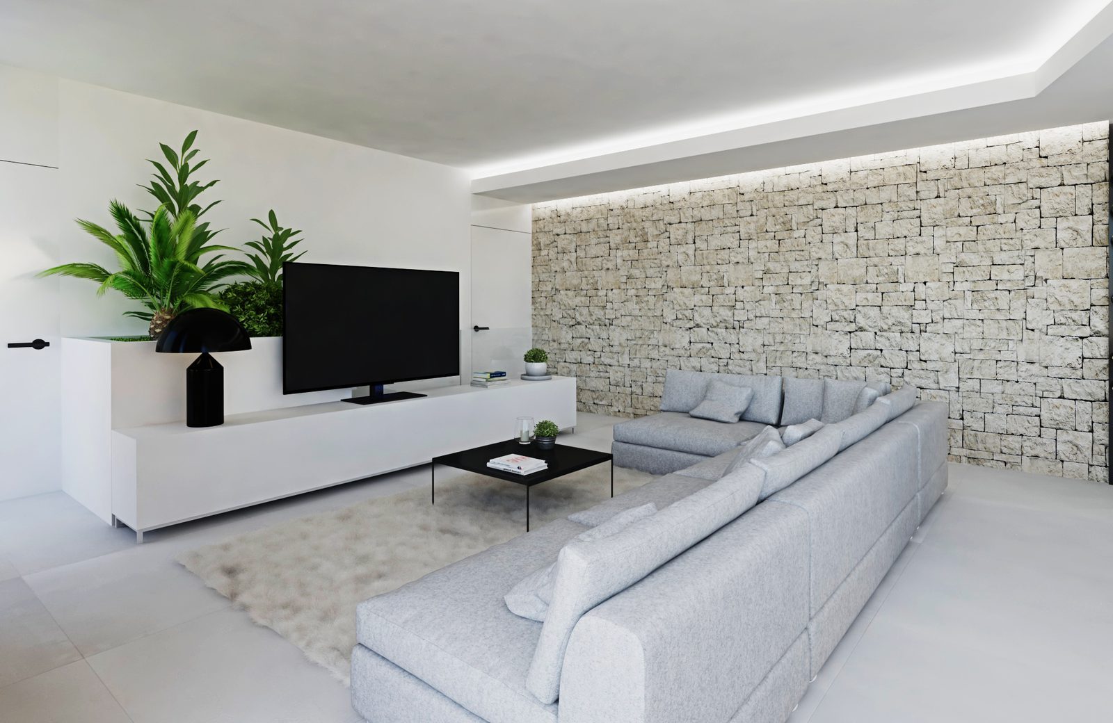 Modern living room with sectional sofa, TV, plants and stone feature wall in a 3-bedroom apartment in Calpe - The Estates