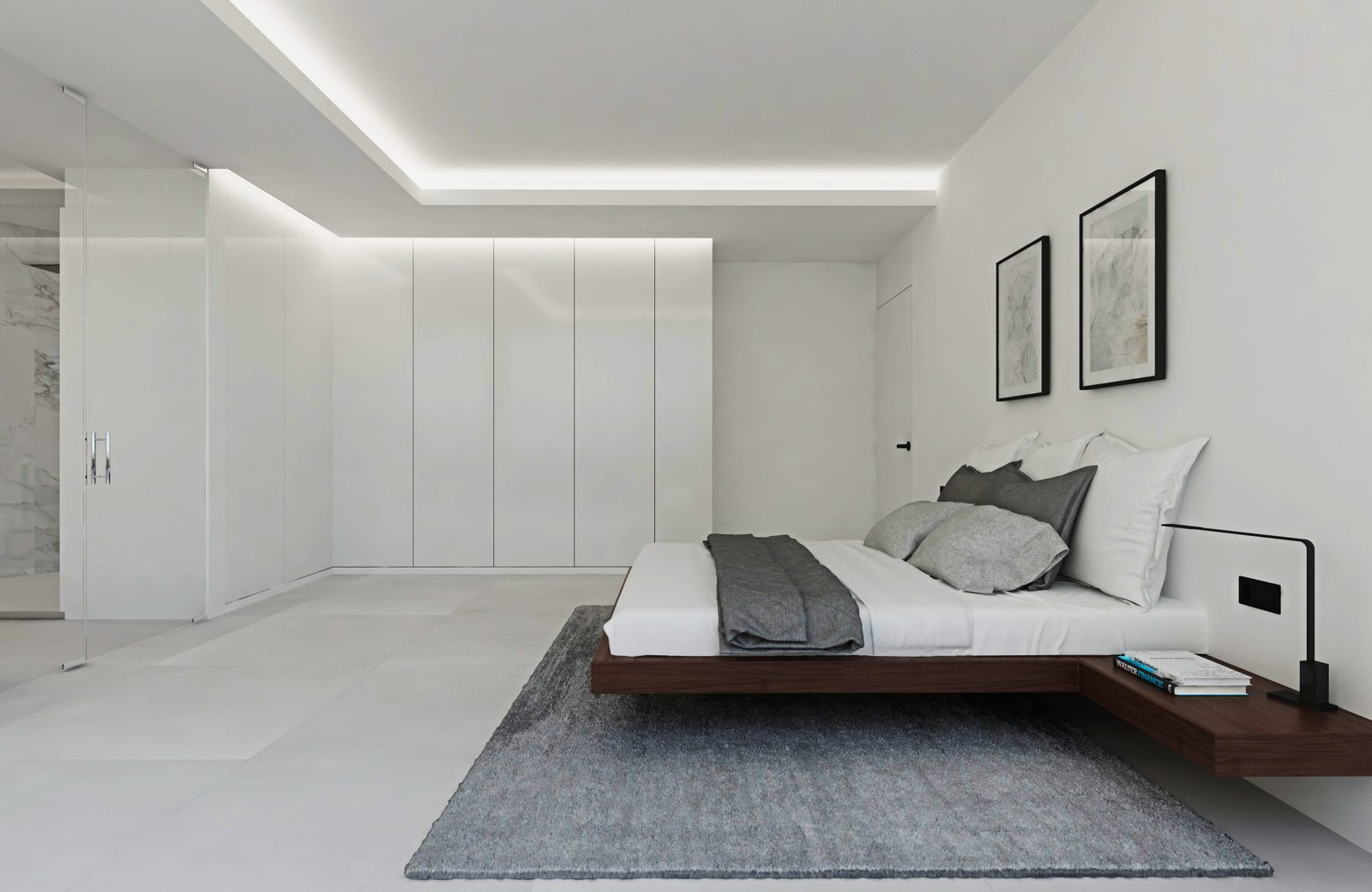 Modern bedroom with fitted wardrobes, platform bed and grey rug in a 3-bedroom apartment in Calpe - The Estates
