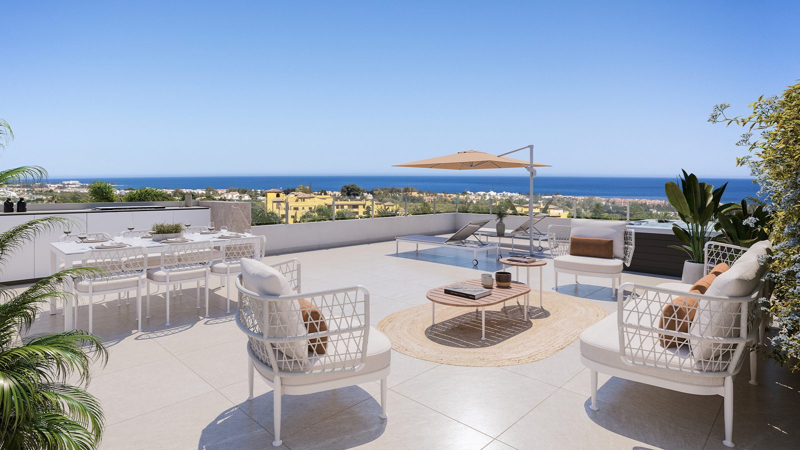 Rooftop terrace with outdoor dining, seating and sea views of a 3-bedroom apartment