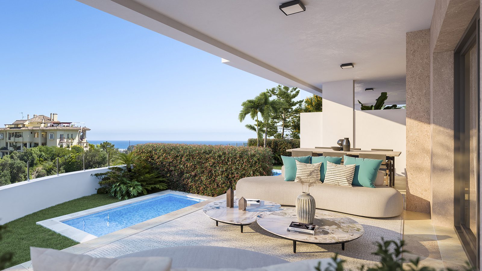 Covered terrace with outdoor seating, private pool and sea views of a 3-bedroom apartment in Estepona - The Estates