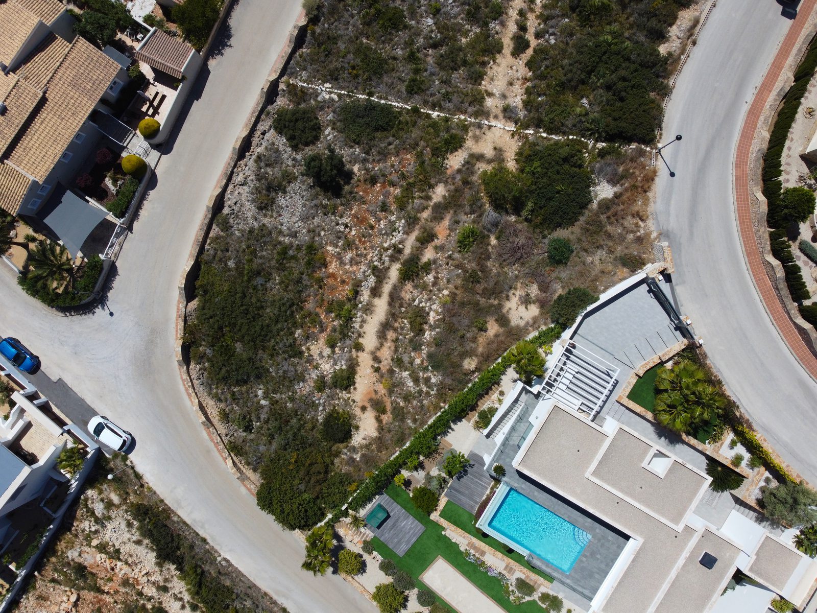 Aerial view of a 3-bedroom villa with private pool and landscaped grounds in Benitachell - The Estates