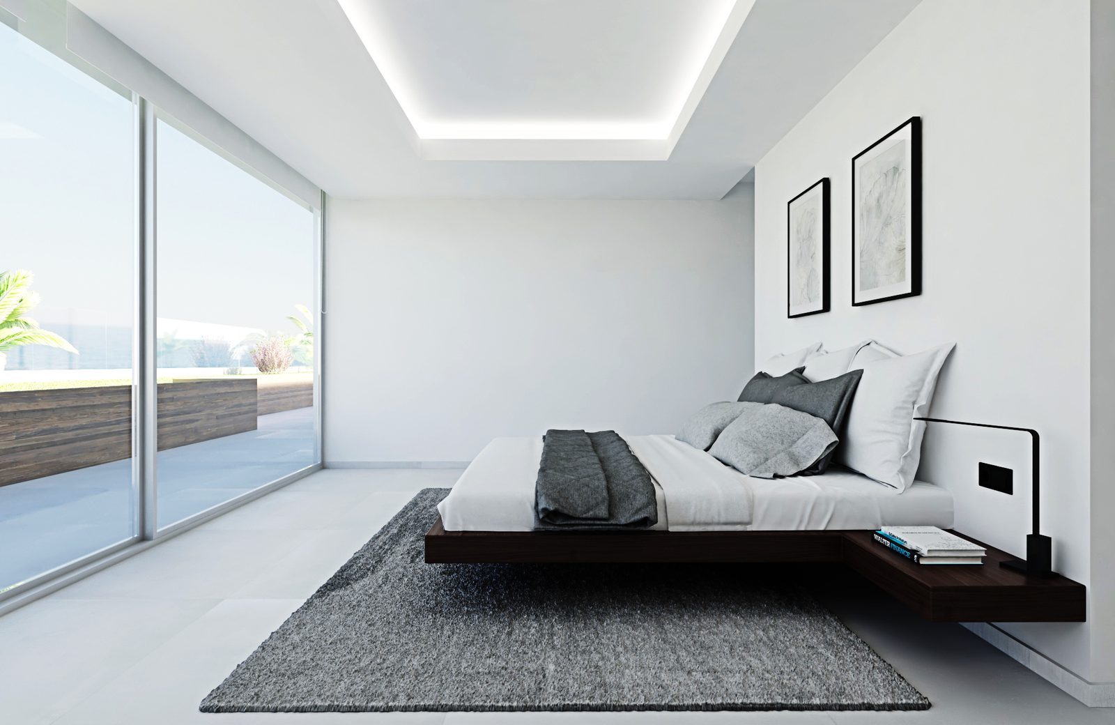 Modern bedroom with floor-to-ceiling windows and sea views of