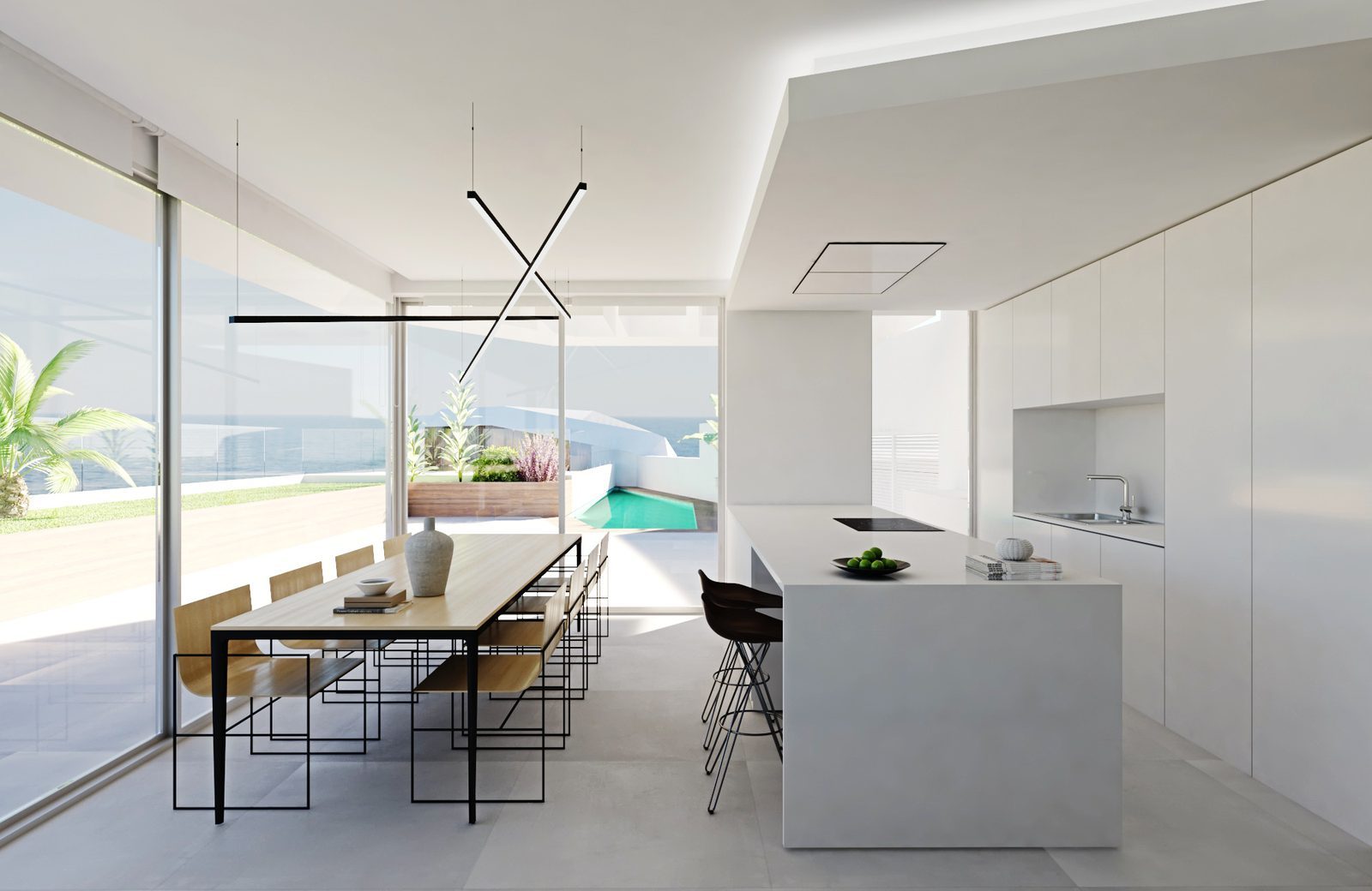 Open-plan kitchen and dining area with sea views, terrace and pool of a 3-bedroom apartment in Calpe - The Estates