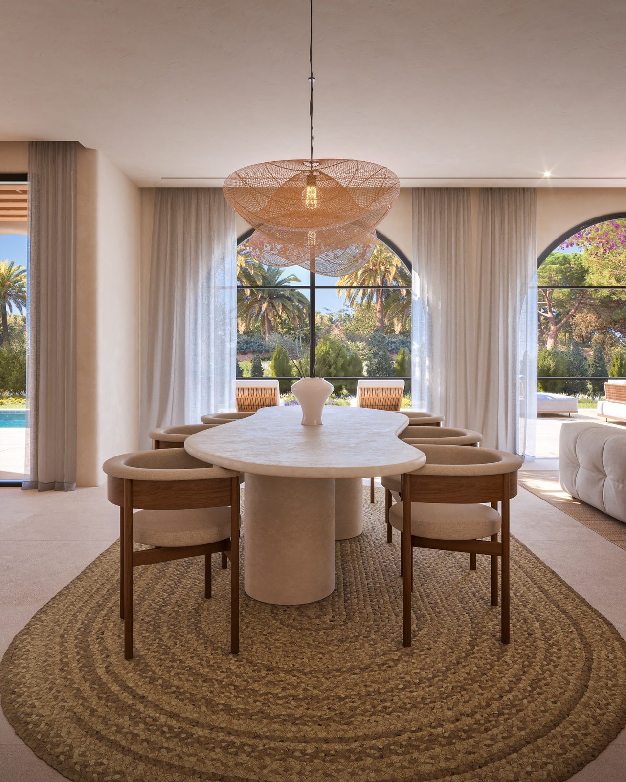 Elegant dining area with large windows overlooking a garden in a 4-bedroom villa in Moraira - The Estates