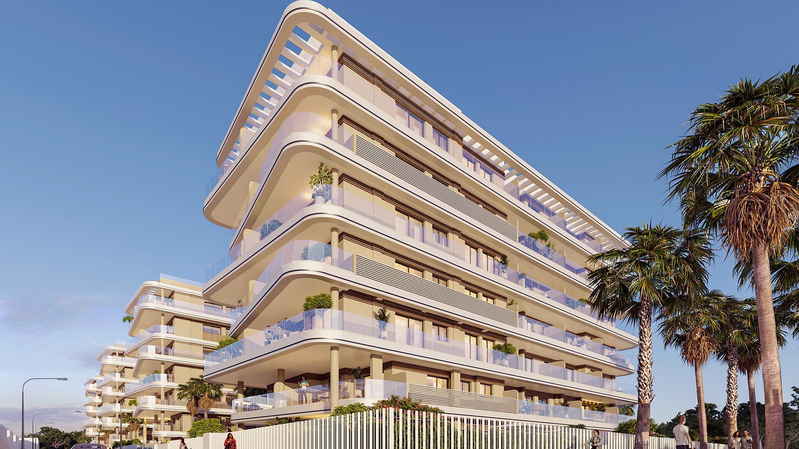 Modern apartment building with curved balconies and palm trees in El Puig, exterior view of a 2-bedroom apartment - The Estates