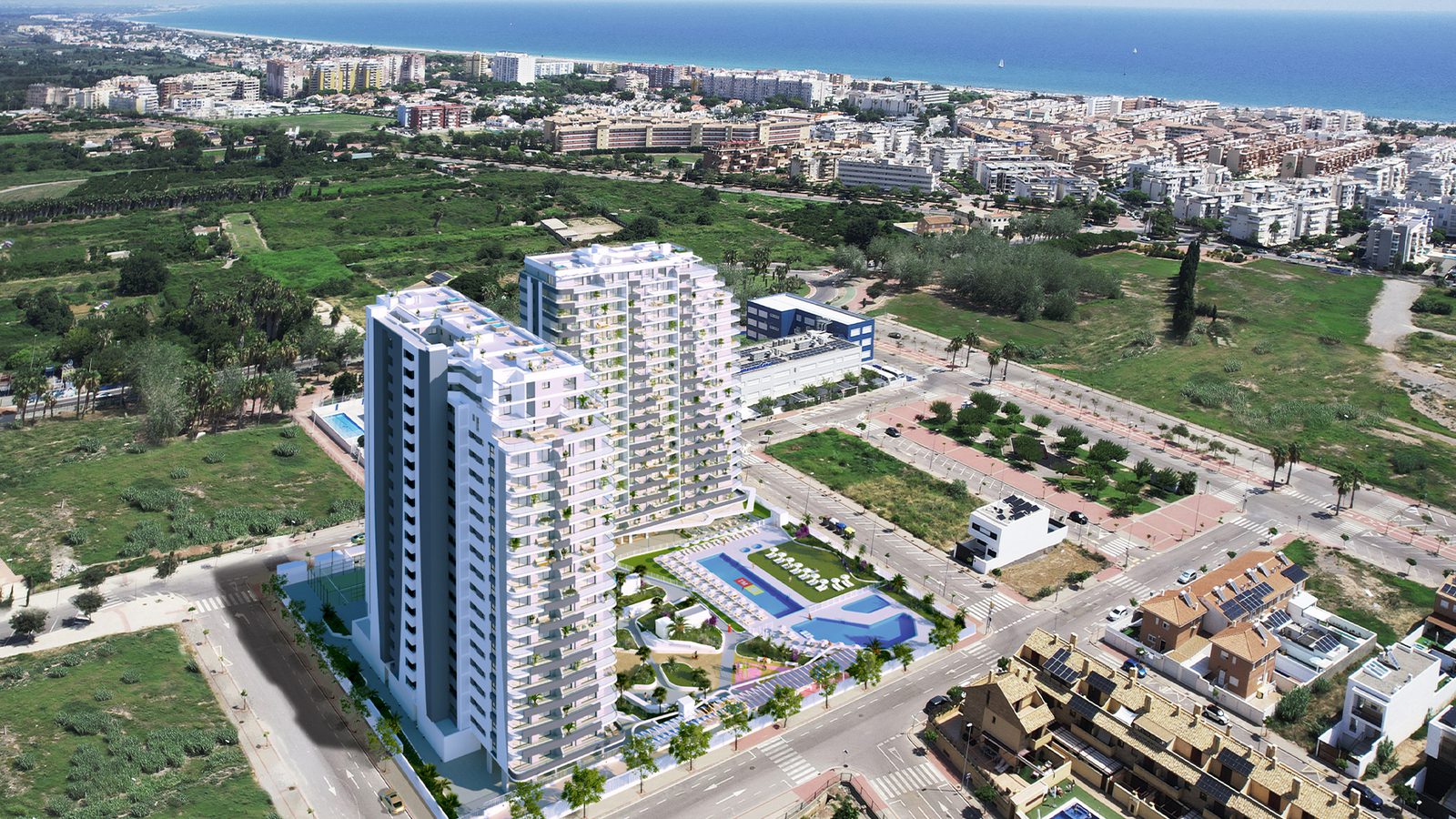 Aerial view of the modern apartment complex and surrounding coastal landscape in Valencia - The Estates