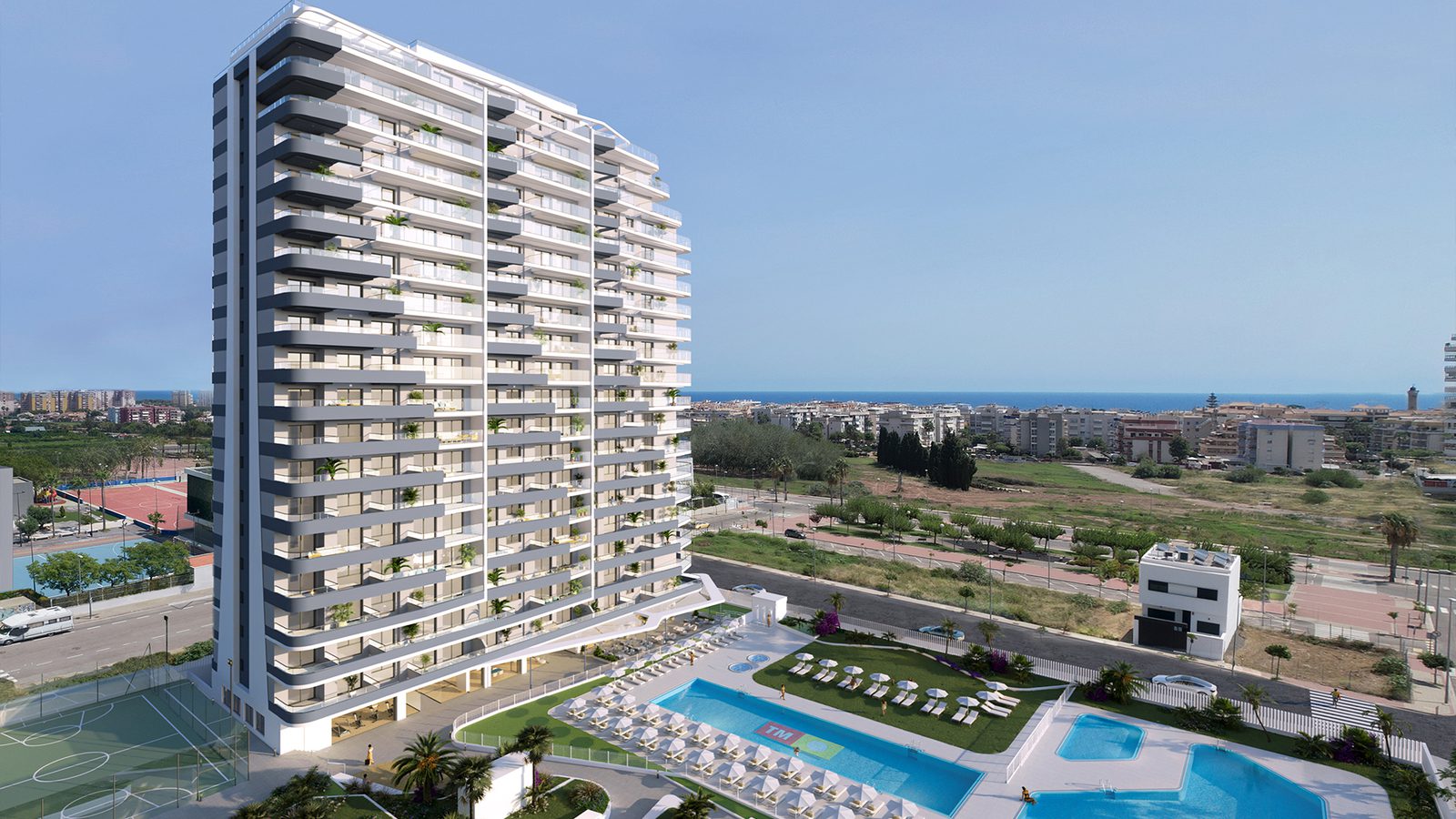 Exterior view of a modern apartment building and pool area in Canet den Berenguer, Valencia - The Estates