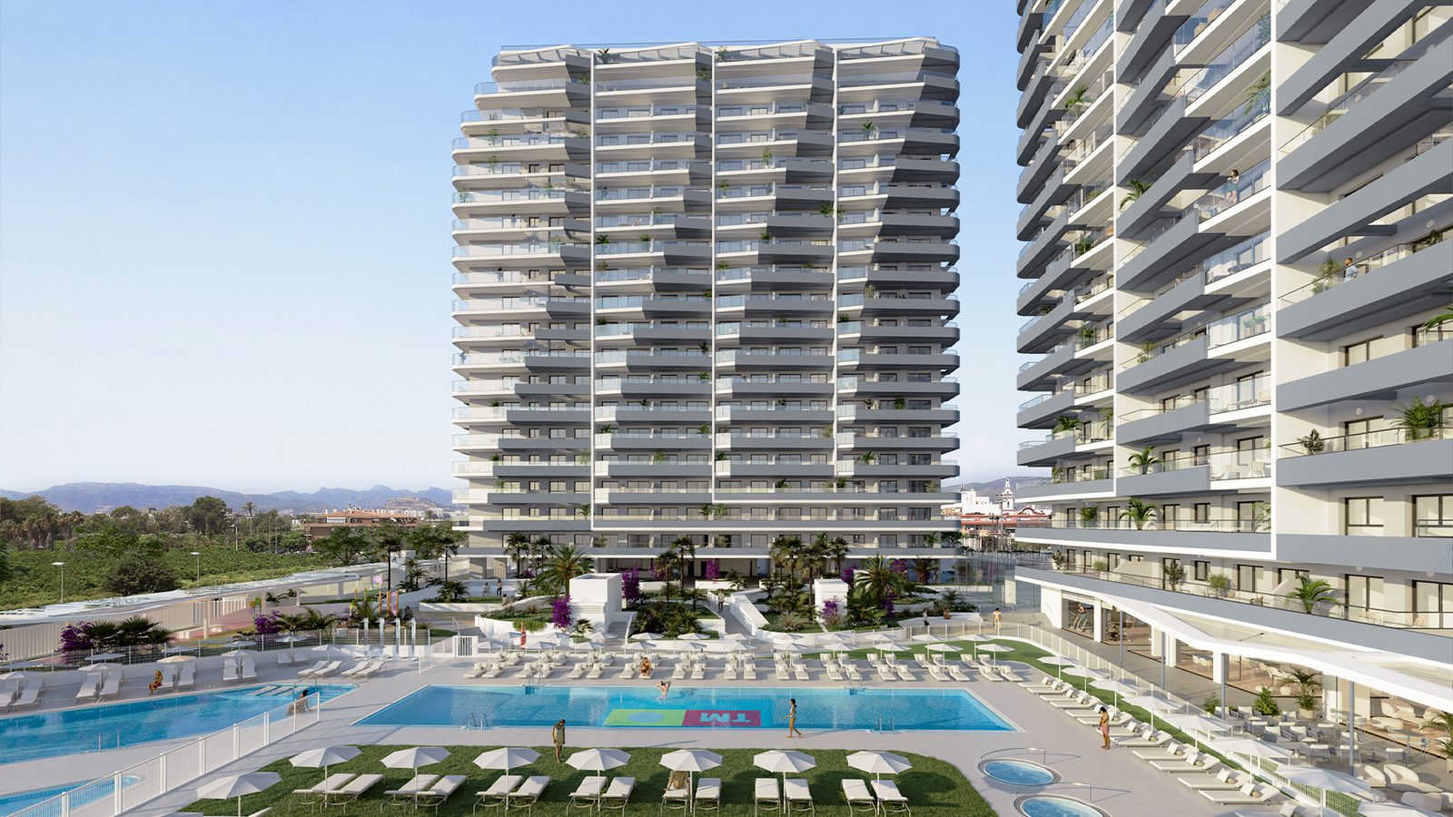 Exterior view of a modern apartment building and pool area in Valencia - The Estates