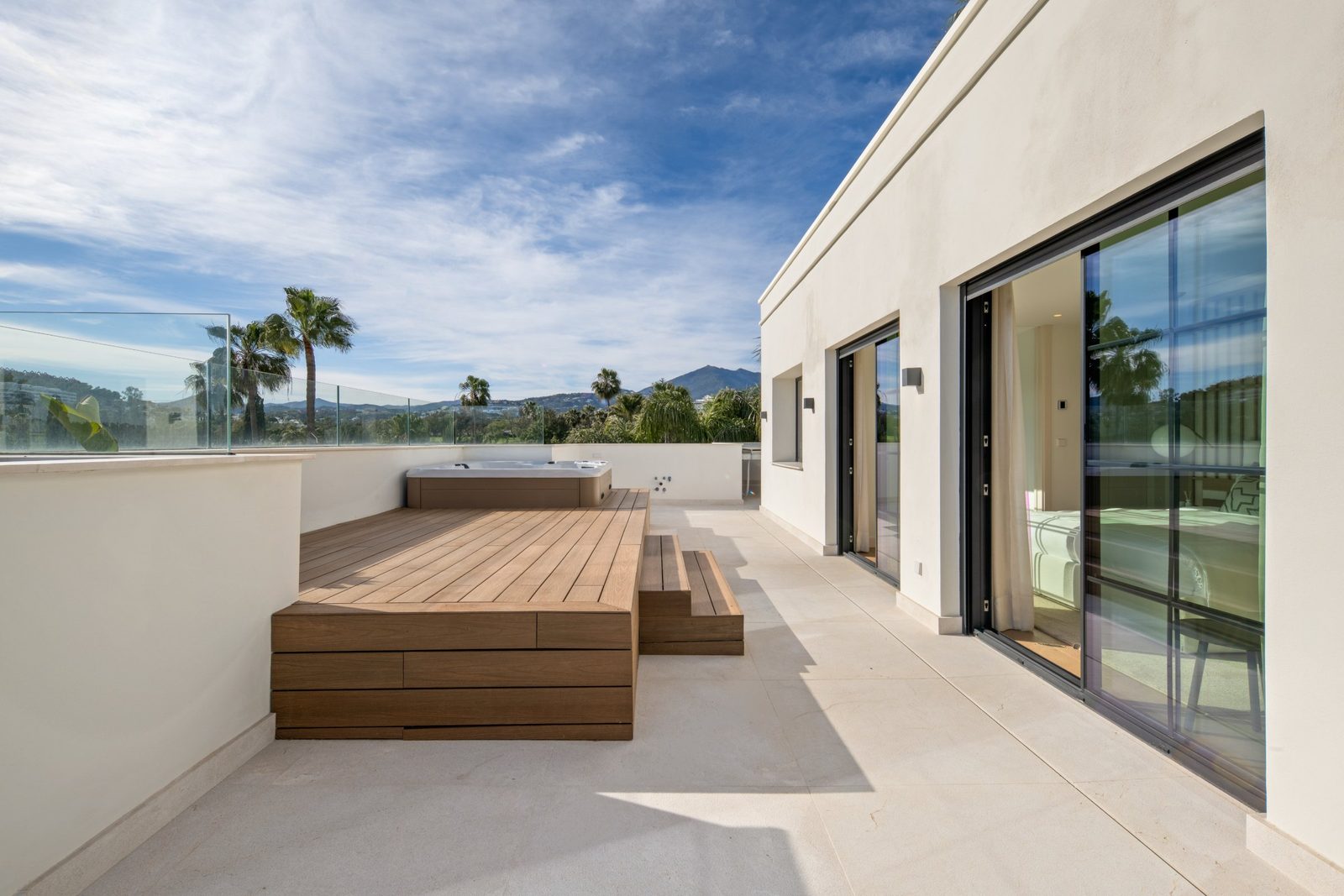 Rooftop terrace with a jacuzzi and mountain views of a 6-bedroom villa in Málaga - The Estates