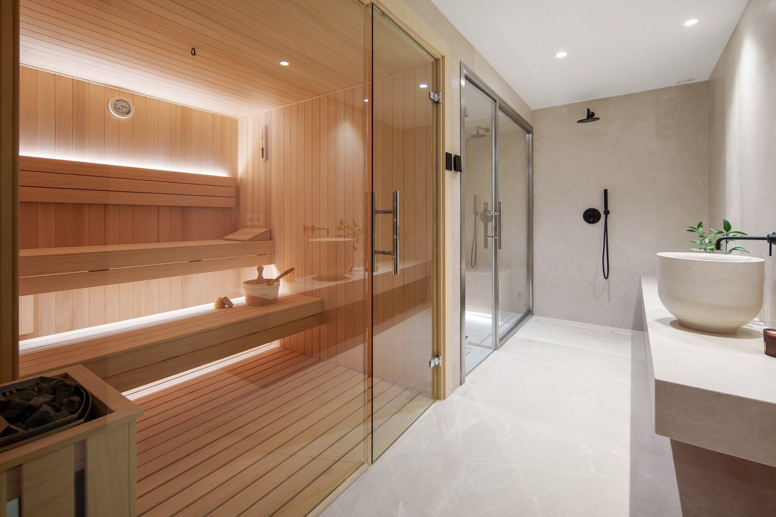 Wood-panelled sauna and adjoining walk-in shower in a luxury spa bathroom of a 6-bedroom villa in Málaga - The Estates