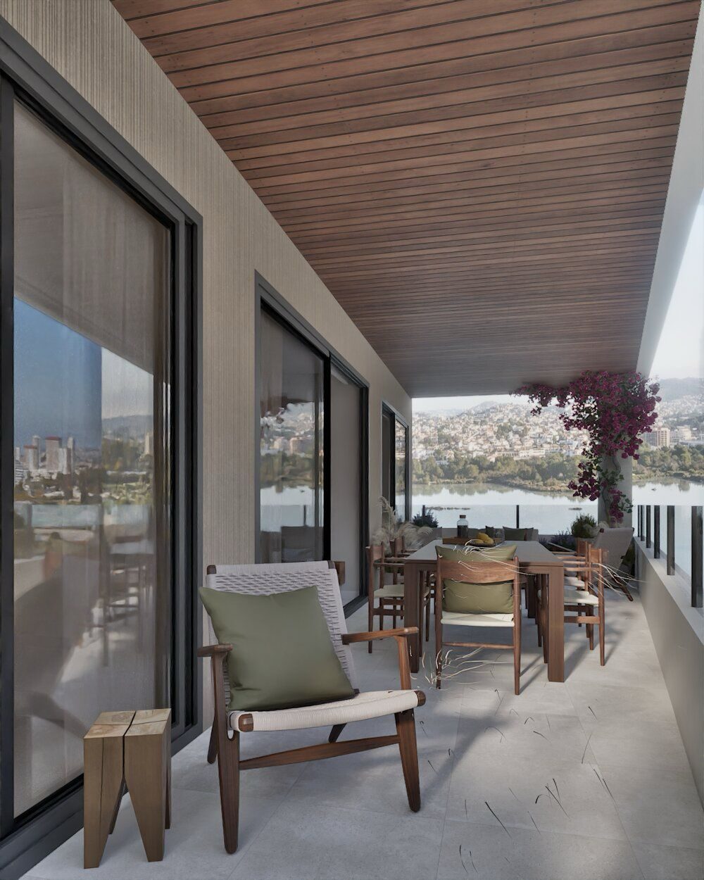 Covered terrace with outdoor dining and seating overlooking the garden and city of Calpe, in a 2-bedroom apartment in Calpe - The Estates