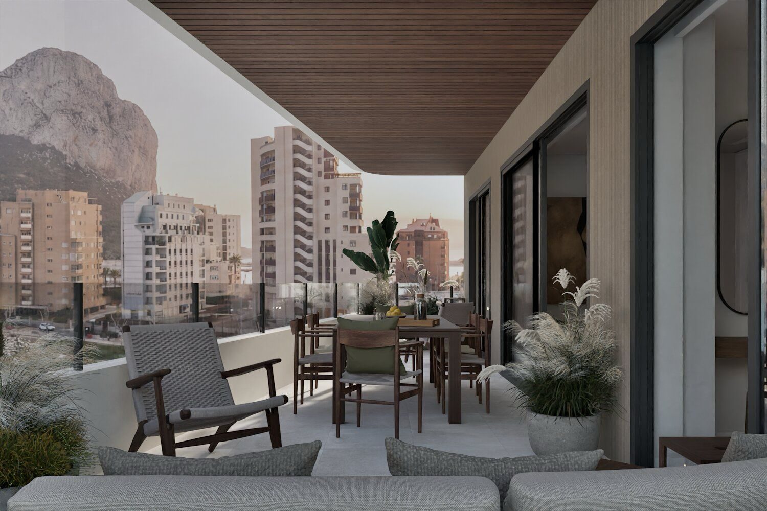 Covered terrace with outdoor dining and seating overlooking Calpe city and mountain, 2-bedroom apartment in Calpe - The Estates