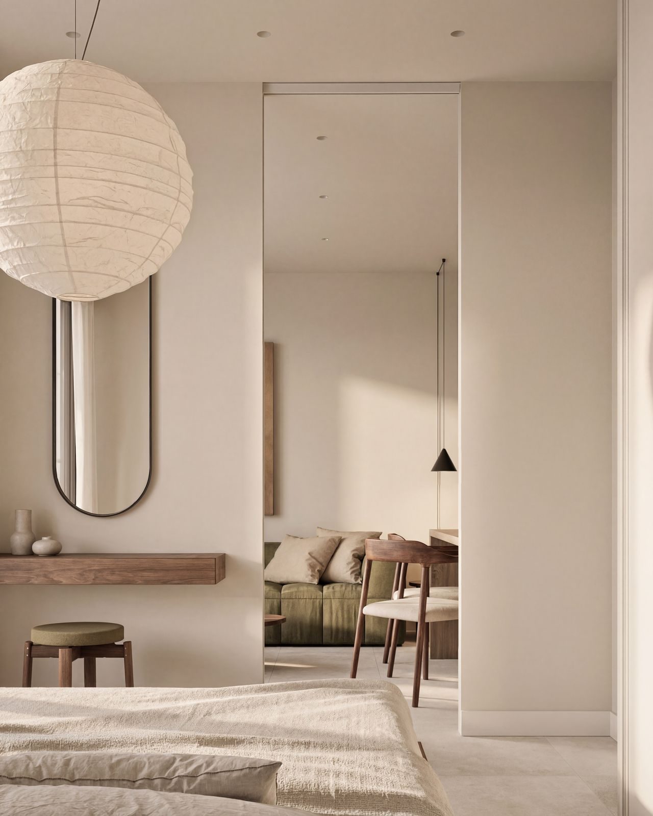 Bedroom with mirror, pendant lighting and view into the living area of a 2-bedroom apartment in Calpe - The Estates