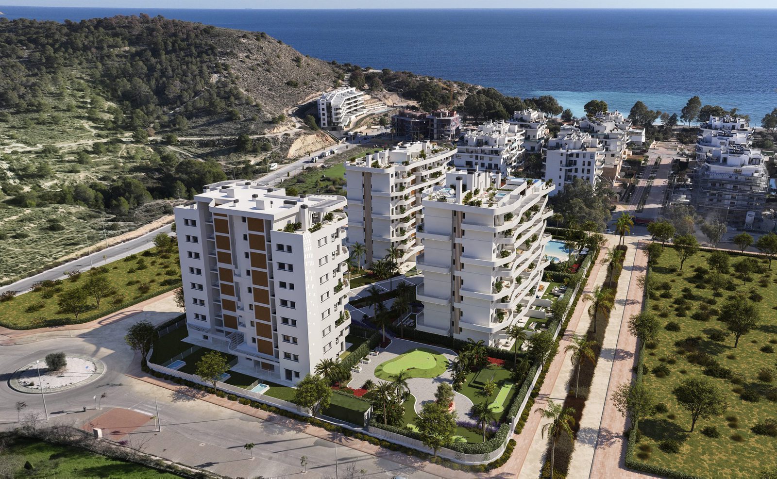Aerial view of a modern apartment complex and stunning sea views in Villajoyosa - The Estates