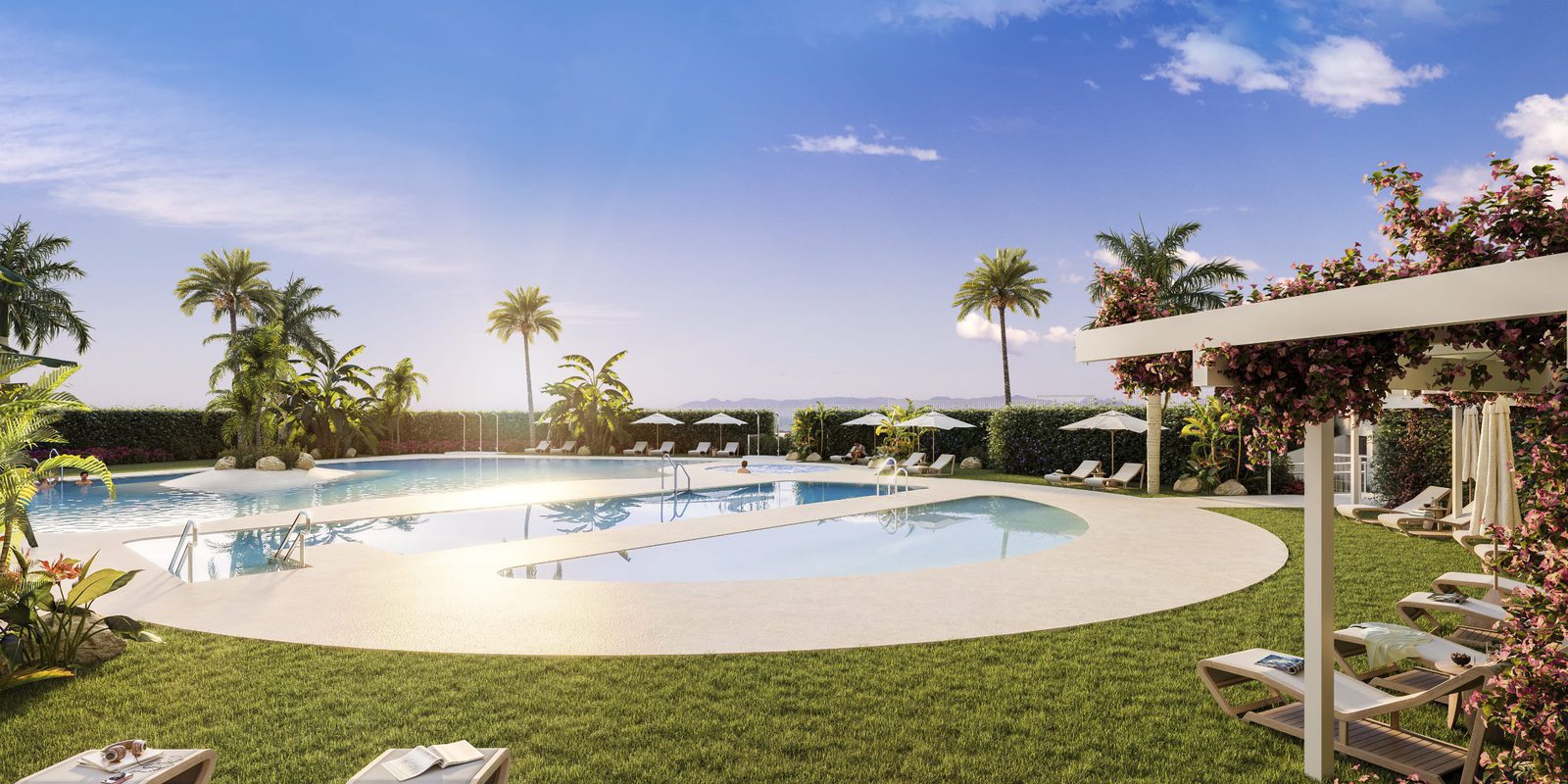 A beautiful pool area with lounge chairs and palm trees near a 2-bedroom apartment in Villajoyosa - The Estates