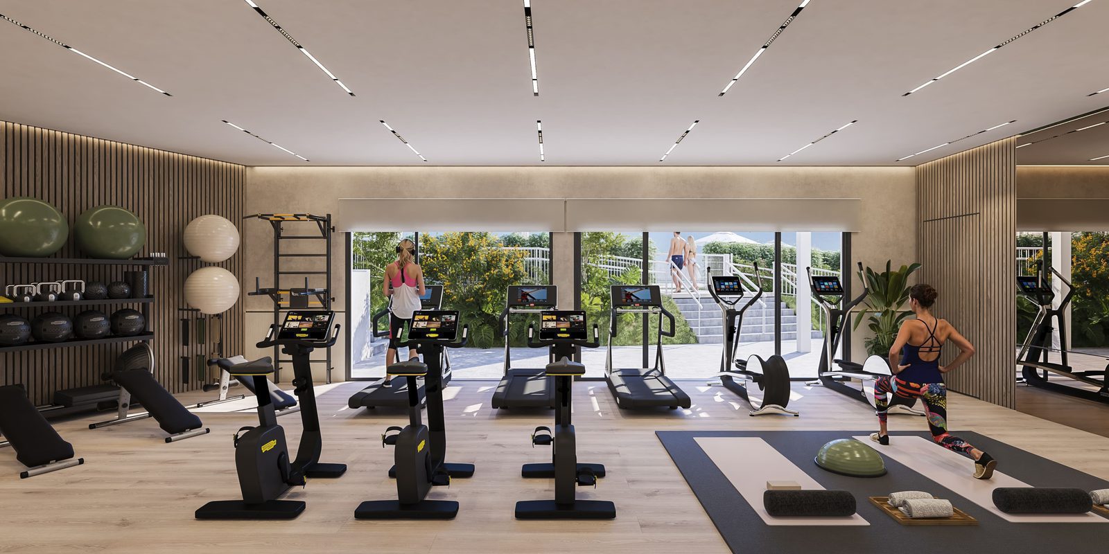 A modern gym with views of greenery inside a 2-bedroom apartment in Villajoyosa - The Estates