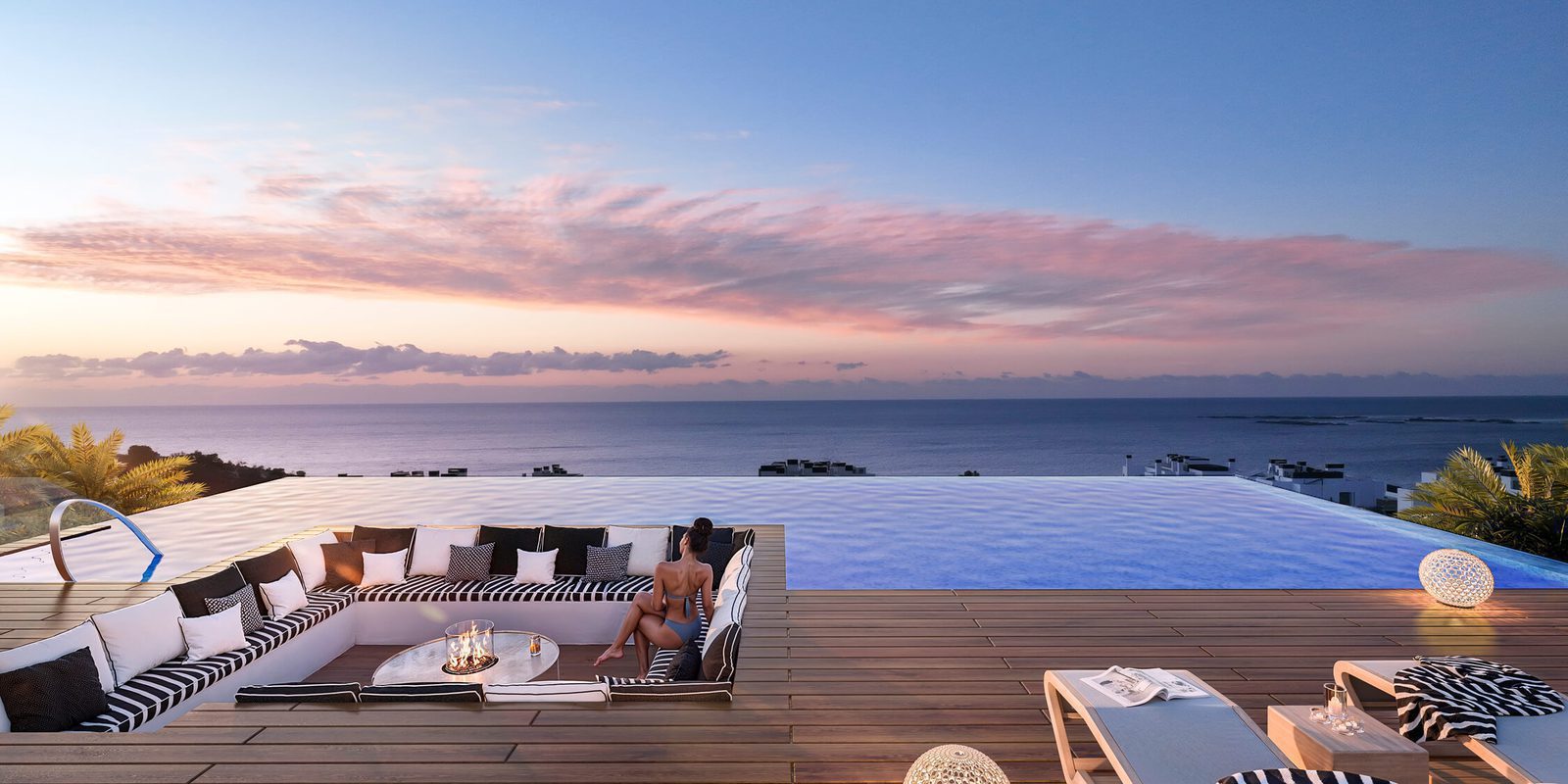 Rooftop terrace with infinity pool, lounge seating and sea views at sunset, in a 3-bedroom apartment in Villajoyosa - The Estates