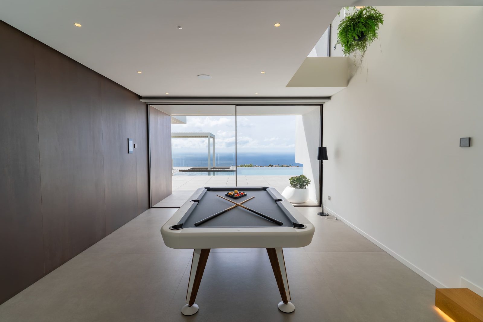 A games room with a pool table and stunning sea views in a 5-bedroom villa in Benitachell - The Estates