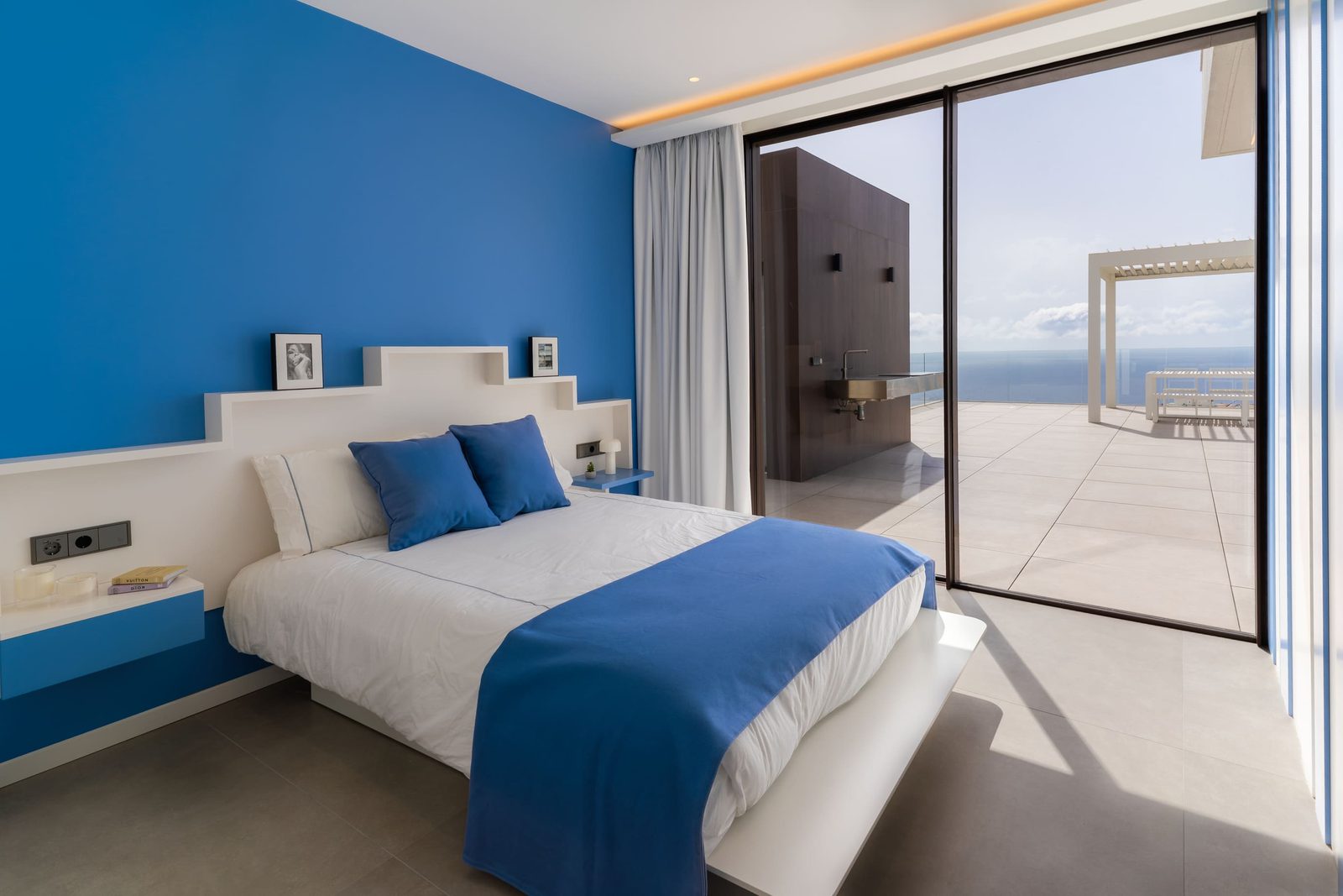 A stylish bedroom with sea views in a 5-bedroom villa in Benitachell - The Estates
