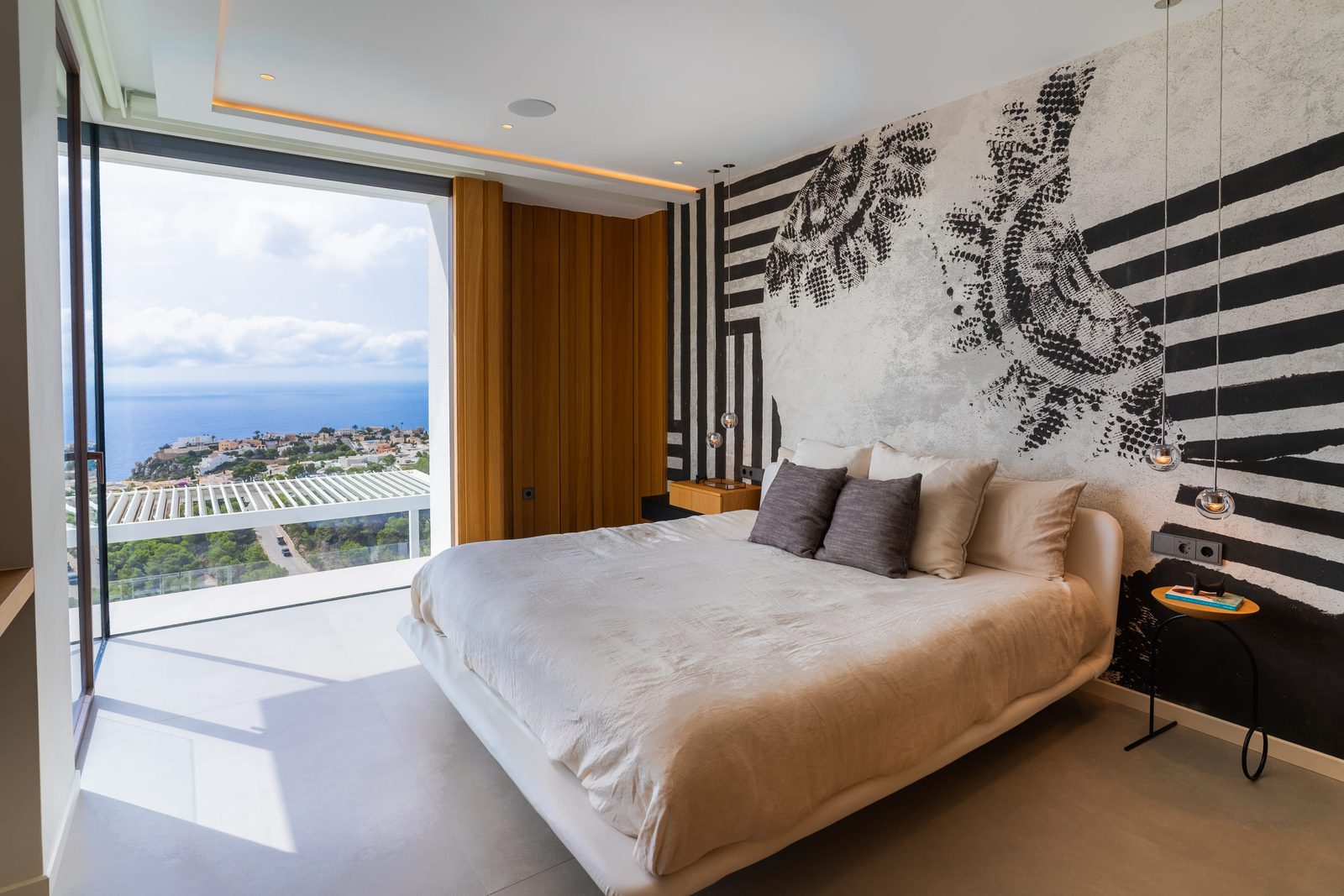 Stylish bedroom with panoramic sea views inside a 5-bedroom villa in Benitachell - The Estates