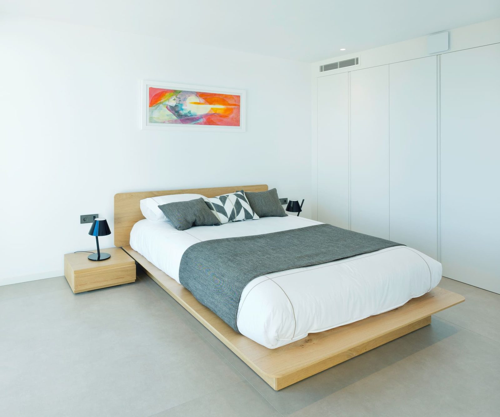 A modern bedroom with stylish decor in a 5-bedroom villa in Benitachell - The Estates