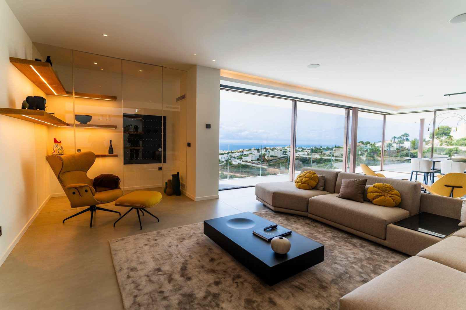 Stylish living room with panoramic sea views inside a 5-bedroom villa in Benitachell - The Estates