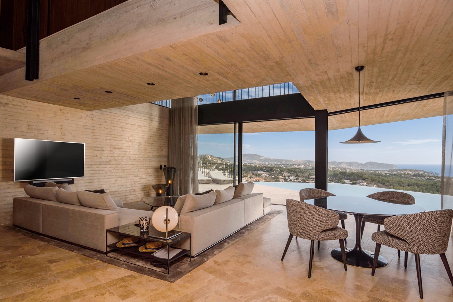 Open-plan living and dining room with panoramic sea views of a 4-bedroom villa in Benissa - The Estates
