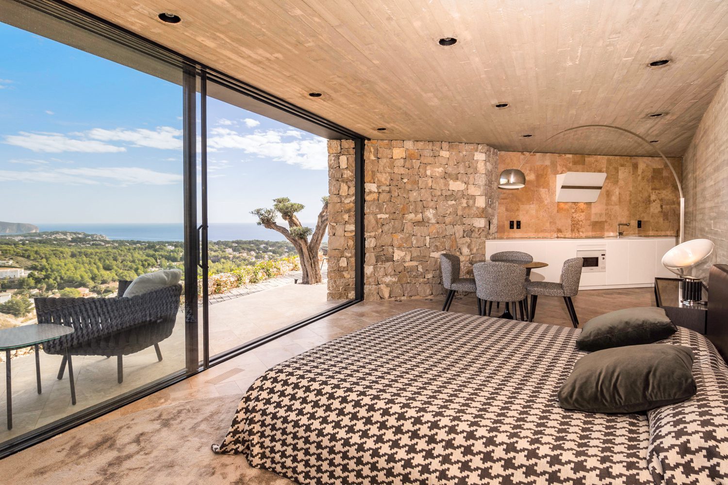 Modern bedroom with kitchenette and panoramic sea views of a 4-bedroom villa in Benissa - The Estates