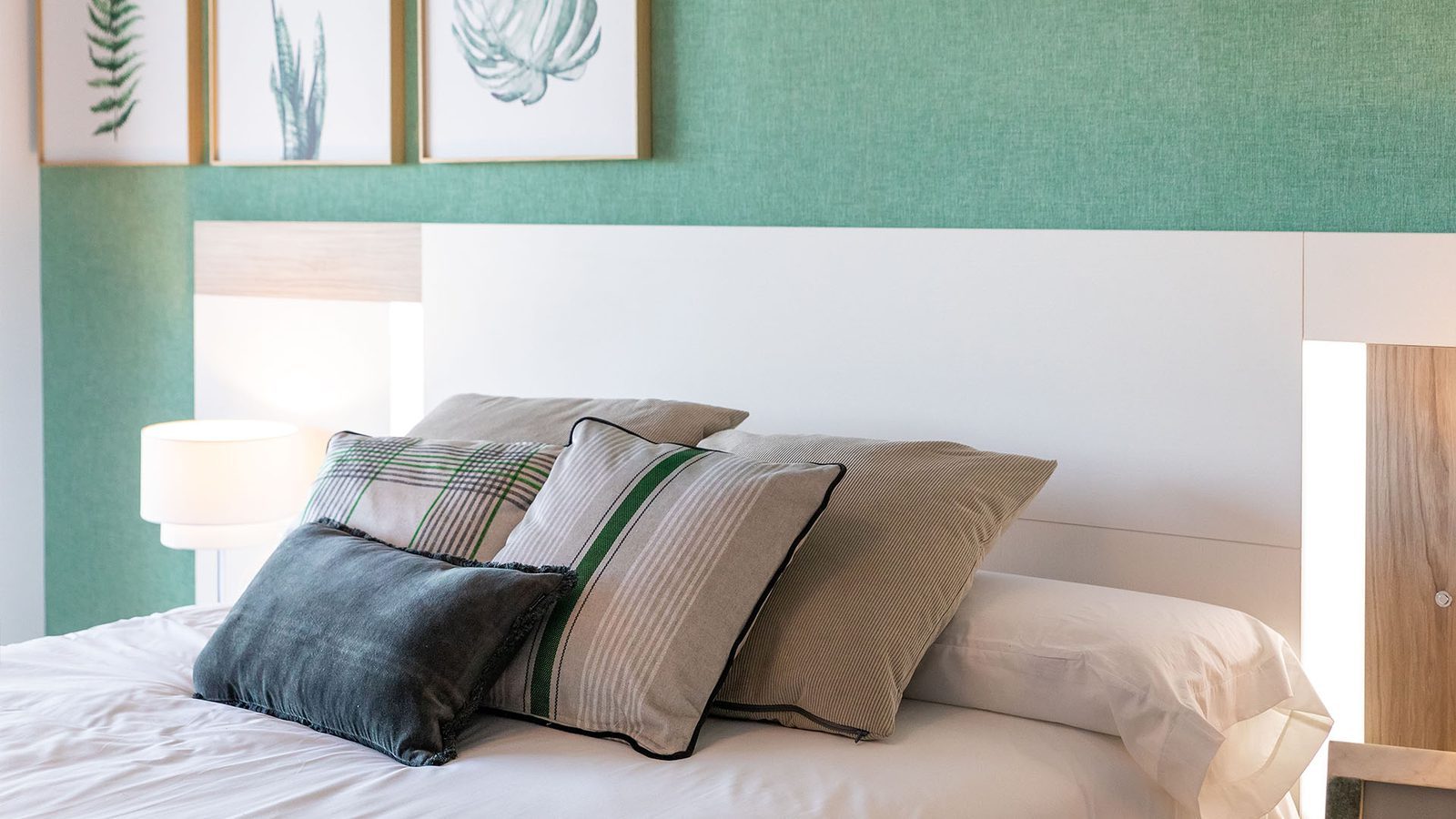 Stylish bedroom with patterned cushions in a 3-bedroom bungalow