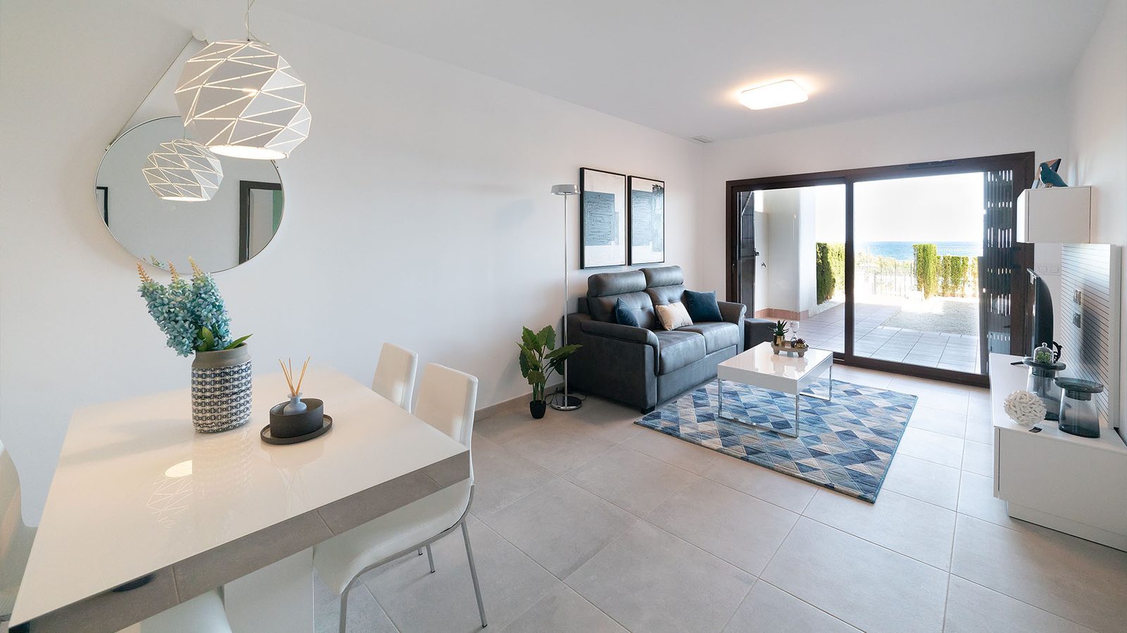 Open-plan living and dining room with sea views in a 3-bedroom bungalow in Pulpí - The Estates