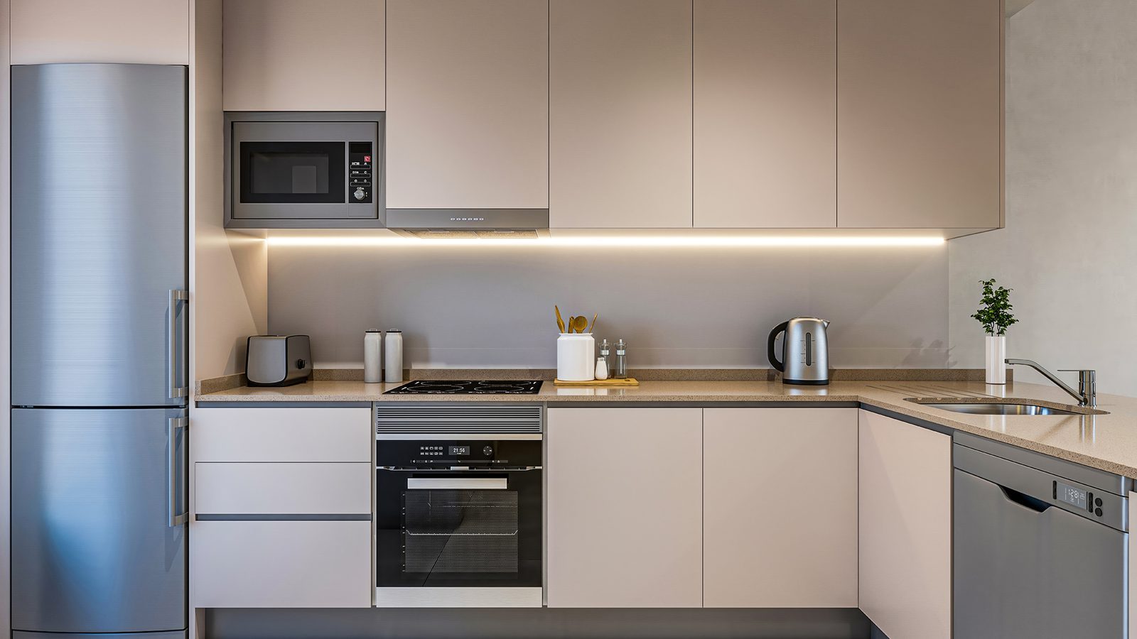 Modern fitted kitchen with integrated appliances and corner sink in a 2-bedroom apartment in Torrevieja - The Estates