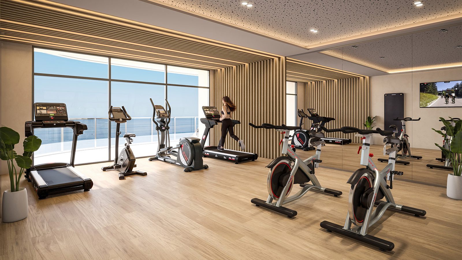 Modern gym with treadmills and exercise bikes at a