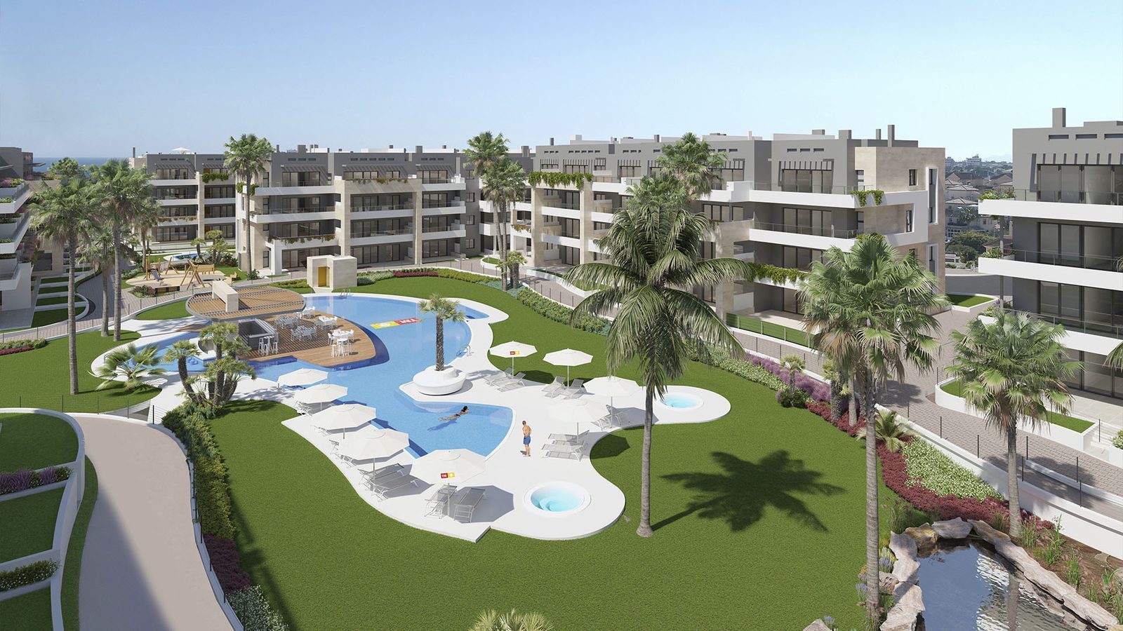 Aerial view of apartment complex with swimming pool, palm trees and landscaped gardens in Orihuela - The Estates