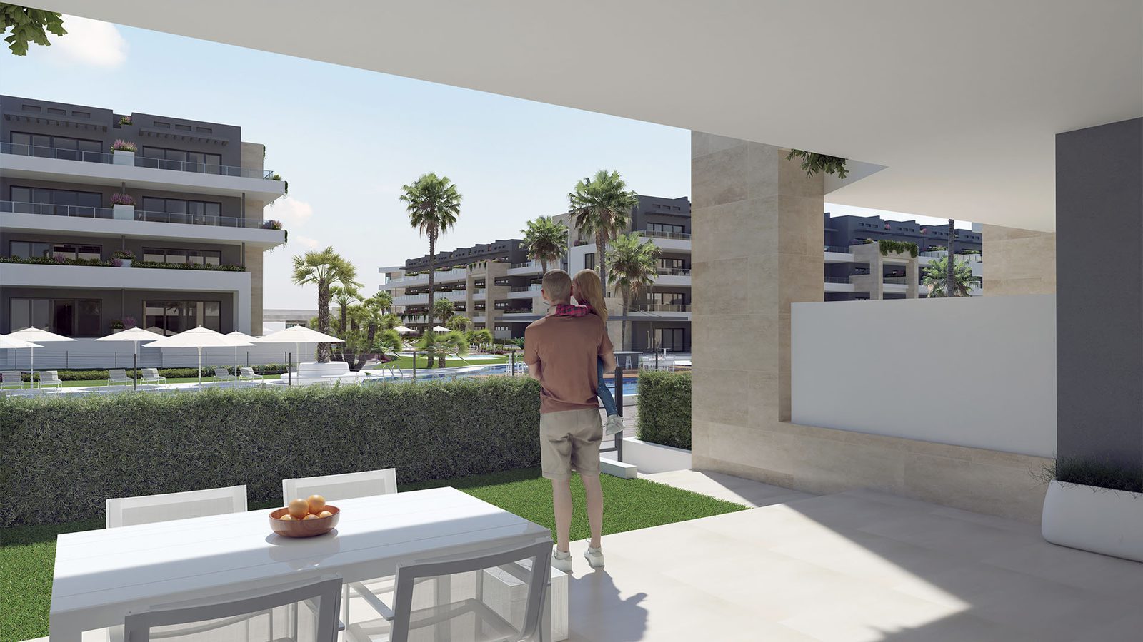 Covered terrace with dining table overlooking landscaped gardens and pools of a 3-bedroom apartment in Orihuela - The Estates