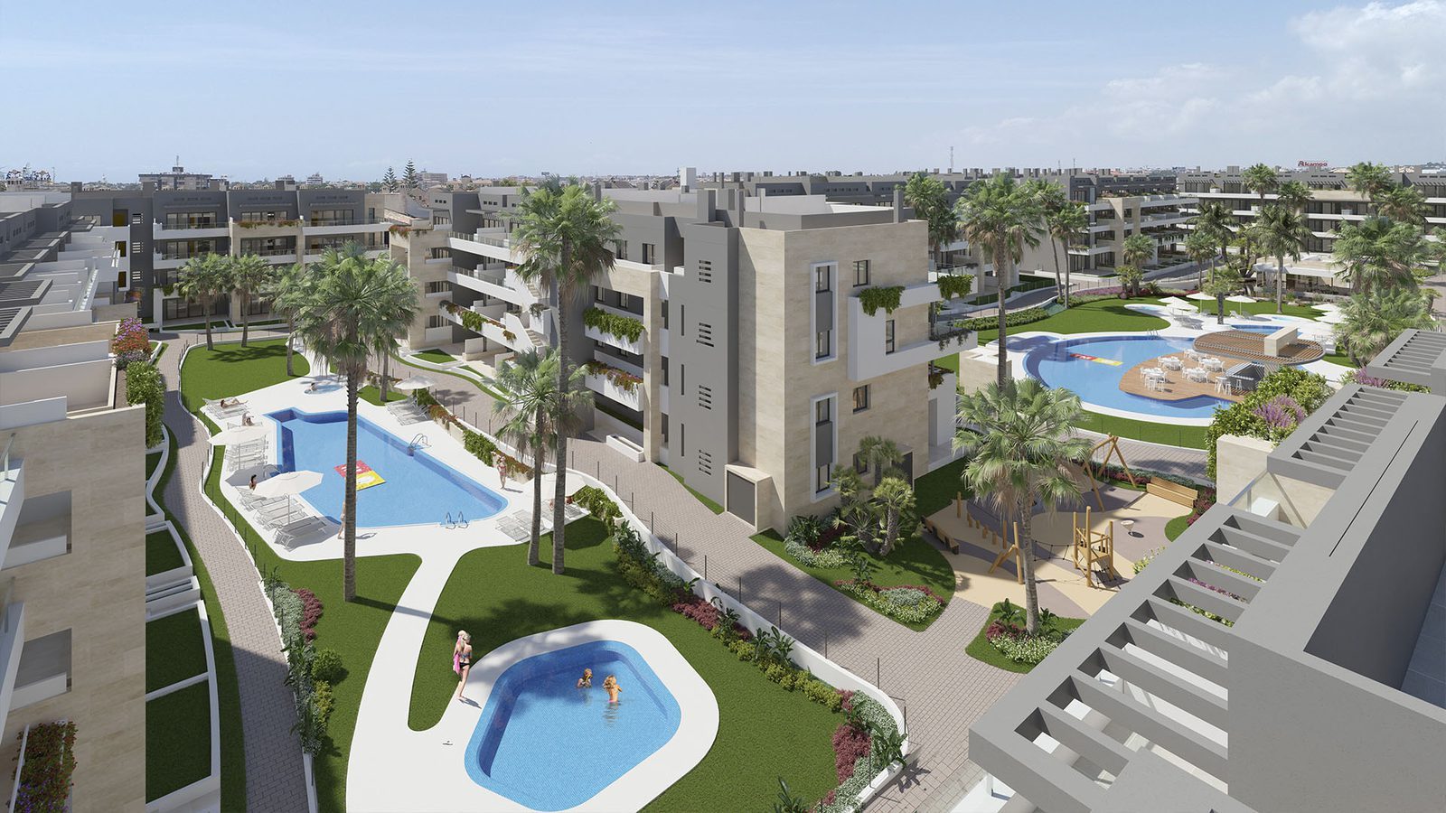Aerial view of apartment complex with pools, palm trees and landscaped gardens, a 3-bedroom