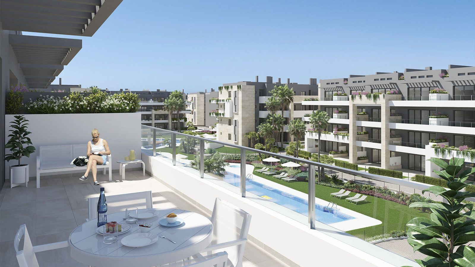 Spacious terrace overlooking landscaped pools and apartment buildings of a 3-bedroom apartment in Orihuela - The Estates
