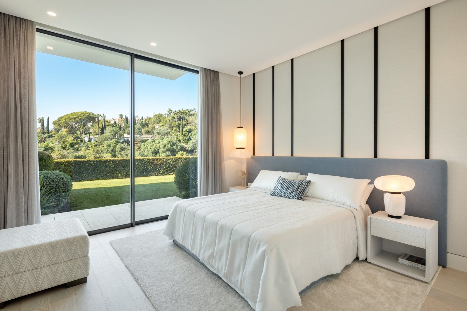 Modern bedroom with garden views of a 6-bedroom villa in Málaga - The Estates