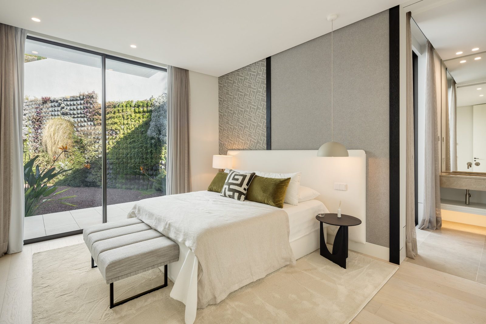 Modern bedroom with garden views in a 6-bedroom villa in Málaga - The Estates