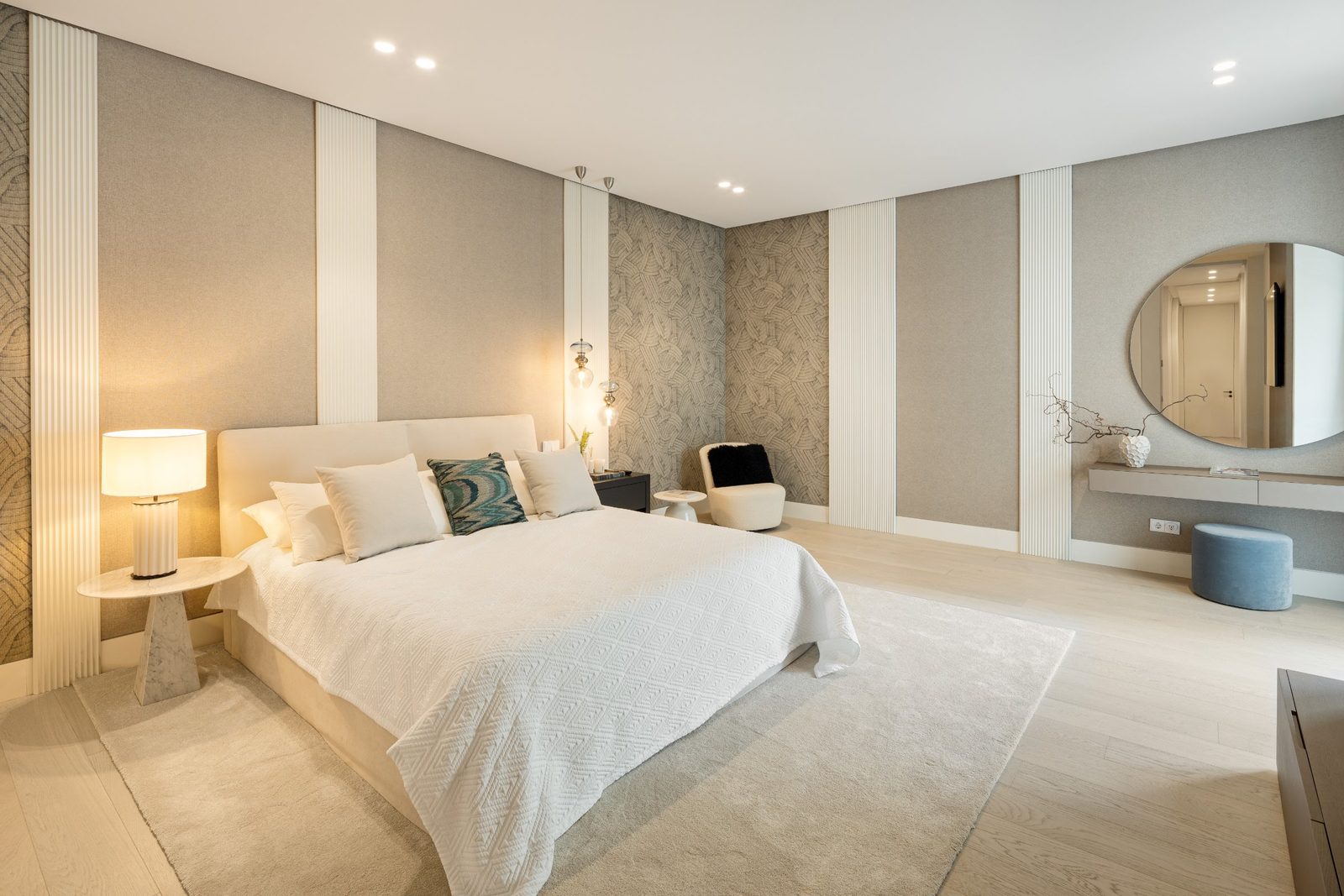 Elegant master bedroom with upholstered bed, patterned walls and contemporary furnishings in a 6-bedroom villa in Málaga - The Estates