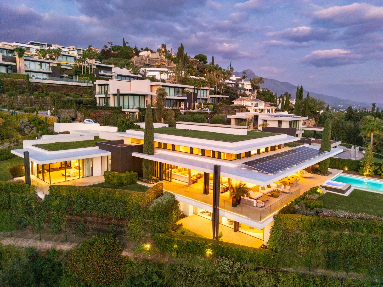 Aerial view of a modern villa with pool,