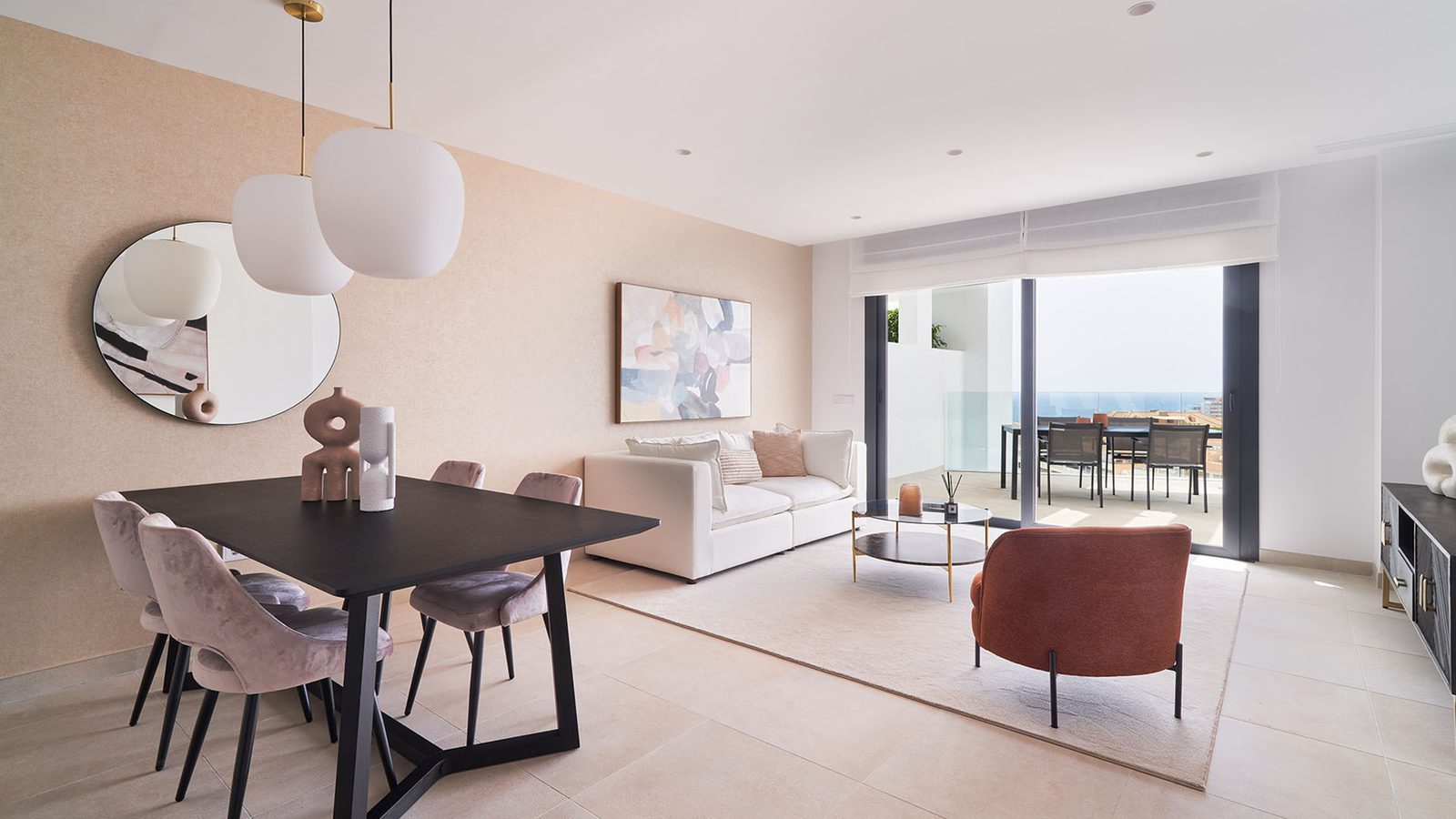Modern living and dining room opening onto a sea-view terrace in a 2-bedroom penthouse in Fuengirola - The Estates